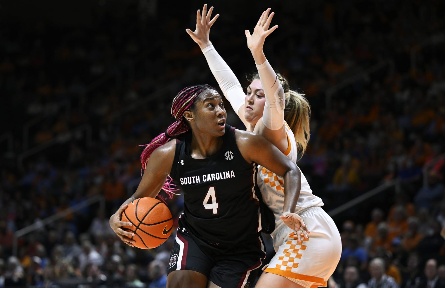 KNOXVILLE, TENNESSEE - FEBRUARY 23: Aliyah Boston #4 of the South Carolina Gamecocks dribbles against Karoline Striplin #11 of the Tennessee Lady Vols in the fourth quarter at Thompson-Boling Arena on February 23, 2023 in Knoxville, Tennessee. (Photo by Eakin Howard/Getty Images)