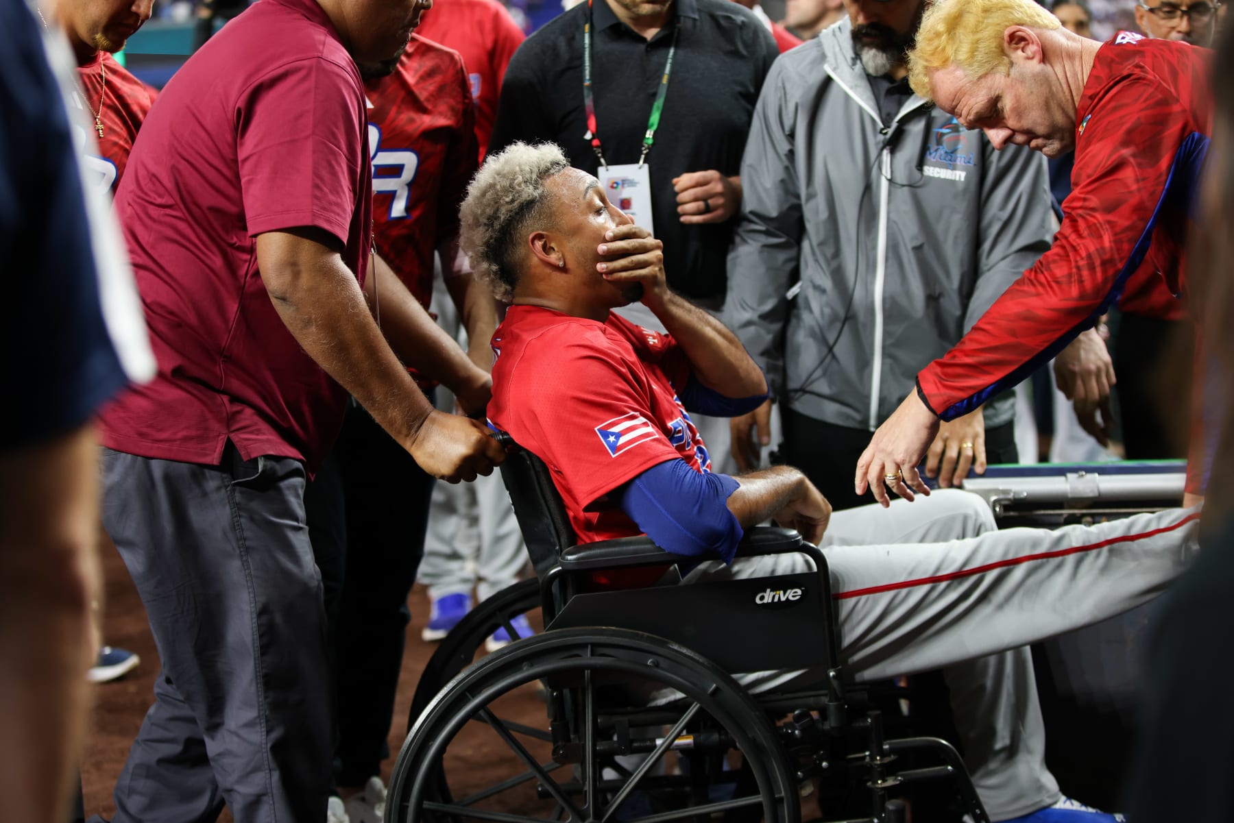 MIAMI, FL - MARCH 15:   Edwin O Díaz #39 of Team Puerto Rico is evaluated in a wheelchair after experiencing an injury after Game 10 of Pool D between Team Puerto Rico and Team Dominican Republic at loanDepot Park on Wednesday, March 15, 2023 in Miami, Florida. (Photo by Rob Tringali/WBCI/MLB Photos via Getty Images)