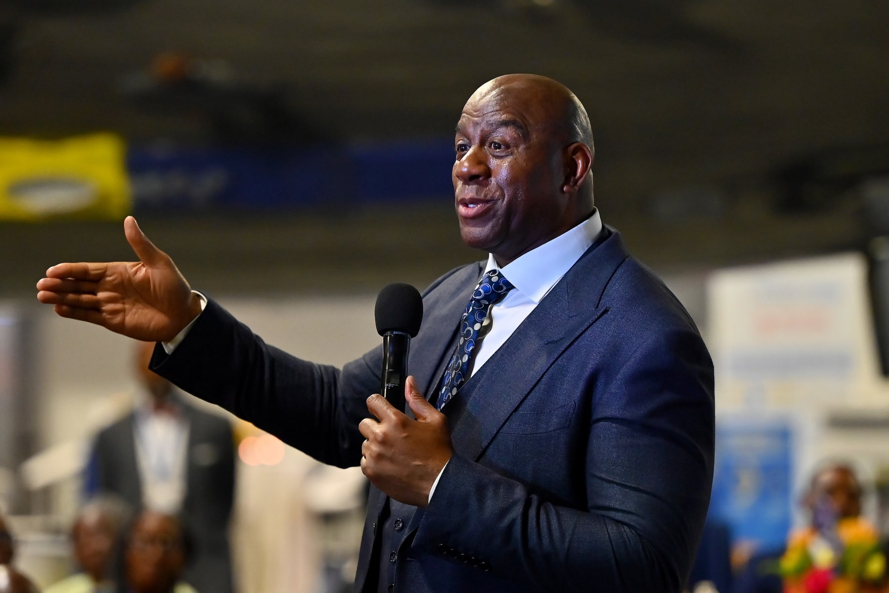 ATLANTA, GEORGIA - MARCH 17: Magic Johnson speaks during the 2023 International Poverty Forum at Delta Flight Museum on March 17, 2023 in Atlanta, Georgia. (Photo by Derek White/Getty Images) ATLANTA, GEORGIA - MARCH 17: Magic Johnson speaks during the 2023 International Poverty Forum at Delta Flight Museum on March 17, 2023 in Atlanta, Georgia. (Photo by Derek White/Getty Images)