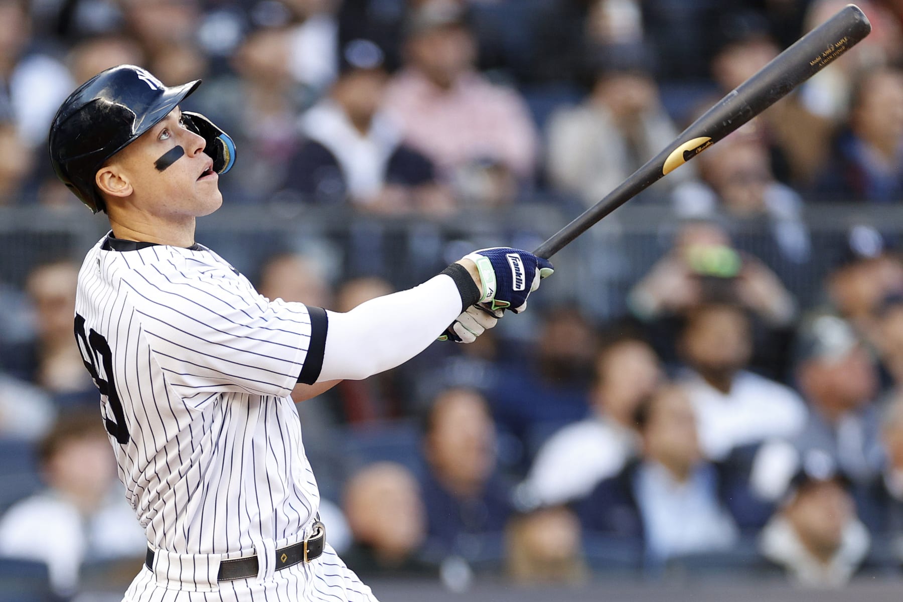 NEW YORK, NEW YORK - OCTOBER 18: Aaron Judge #99 of the New York Yankees hits a home run against the Cleveland Guardians during the second inning in game five of the American League Division Series at Yankee Stadium on October 18, 2022 in New York, New York. (Photo by Sarah Stier/Getty Images)