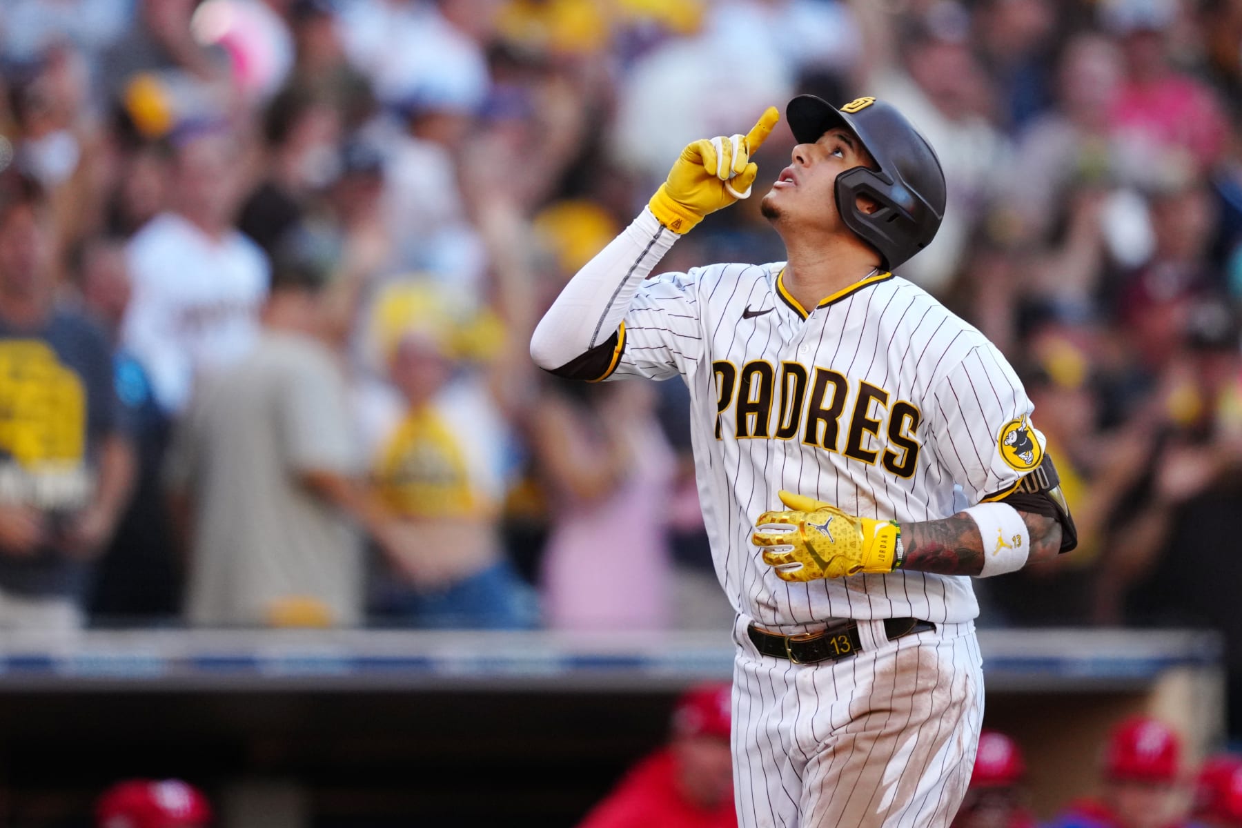 SAN DIEGO, CA - OCTOBER 19: Manny Machado #13 of the San Diego Padres reacts after a home run during Game 2 of the NLCS between the Philadelphia Phillies and the San Diego Padres at Petco Park on Wednesday, October 19, 2022 in San Diego, California. (Photo by Daniel Shirey/MLB Photos via Getty Images)