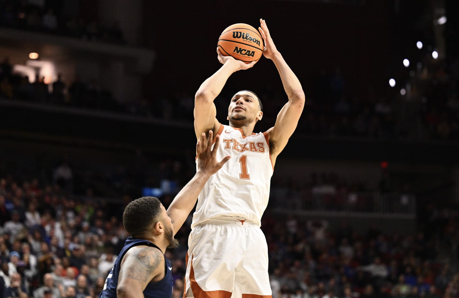 DES MOINES, IA - MARCH 18: Dylan Disu #1 of the Texas Longhorns shoots against Myles Dread #2 of the Penn State Nittany Lions during the second round of the 2023 NCAA Men's Basketball Tournament held at Wells Fargo Arena on March 18, 2023 in Des Moines, Iowa. (Photo by Jamie Sabau/NCAA Photos via Getty Images)