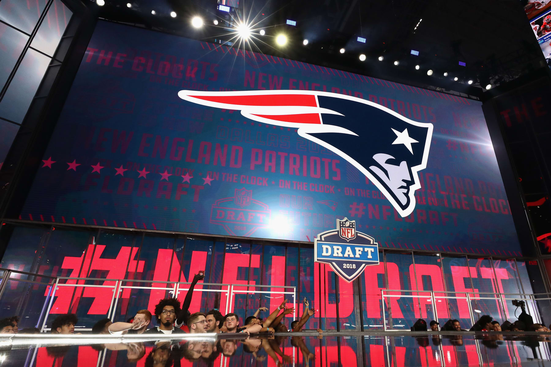 ARLINGTON, TX - APRIL 26: The New England Patriots logo is seen on a video board during the first round of the 2018 NFL Draft at AT&T Stadium on April 26, 2018 in Arlington, Texas. (Photo by Ronald Martinez/Getty Images) ARLINGTON, TX - APRIL 26: The New England Patriots logo is seen on a video board during the first round of the 2018 NFL Draft at AT&T Stadium on April 26, 2018 in Arlington, Texas. (Photo by Ronald Martinez/Getty Images)