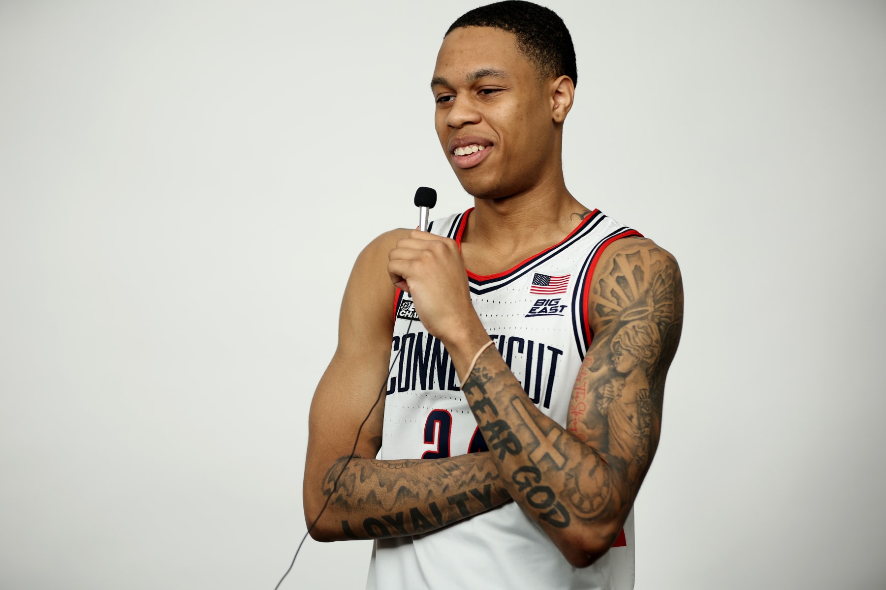 HOUSTON, TEXAS - MARCH 30: Jordan Hawkins #24 of the Connecticut Huskies smiles during media availability for the Final Four as part of the NCAA Men's Basketball Tournament at NRG Stadium on March 30, 2023 in Houston, Texas. (Photo by Jamie Schwaberow/NCAA Photos via Getty Images)