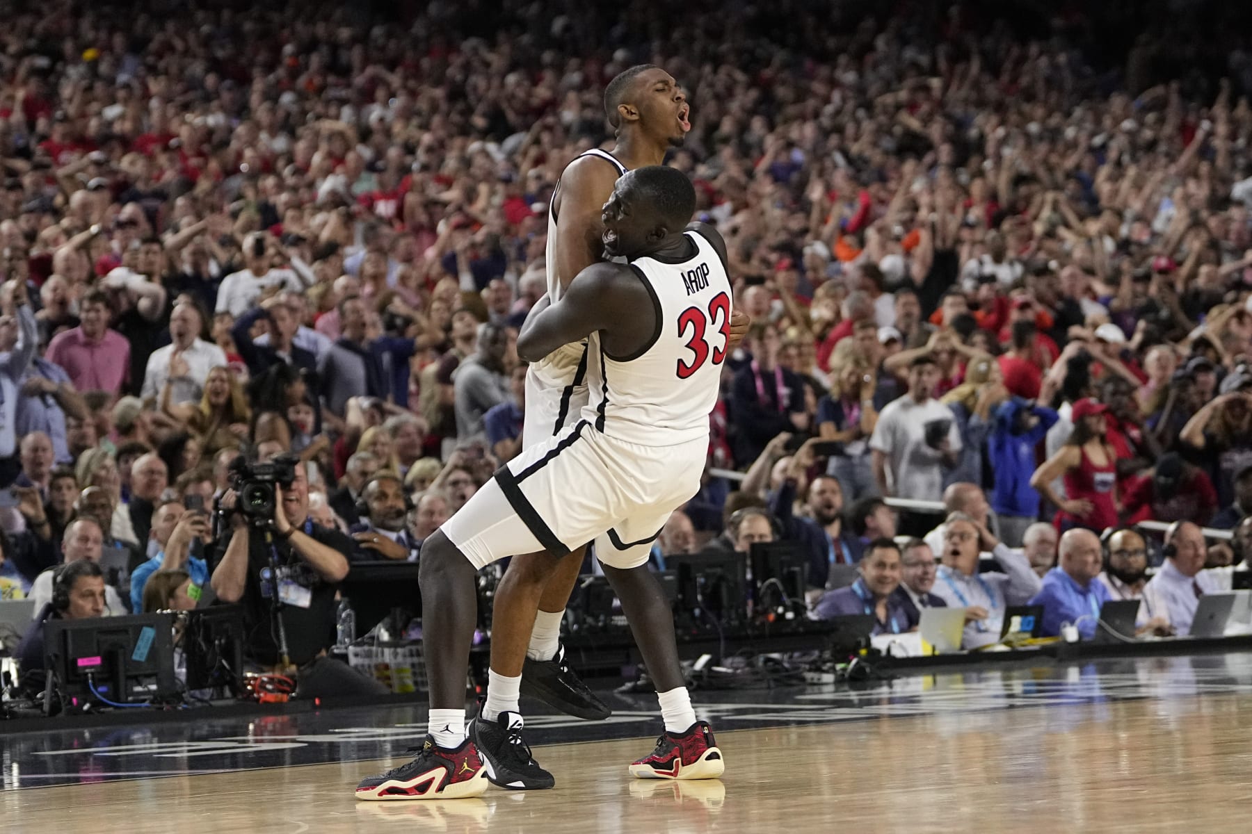 San Diego State guard Lamont Butler, left, celebrates after scoring the game winning basket with forward Aguek Arop during the second half of a Final Four college basketball game against Florida Atlantic in the NCAA Tournament on Saturday, April 1, 2023, in Houston. (AP Photo/David J. Phillip) San Diego State guard Lamont Butler, left, celebrates after scoring the game winning basket with forward Aguek Arop during the second half of a Final Four college basketball game against Florida Atlantic in the NCAA Tournament on Saturday, April 1, 2023, in Houston. (AP Photo/David J. Phillip)