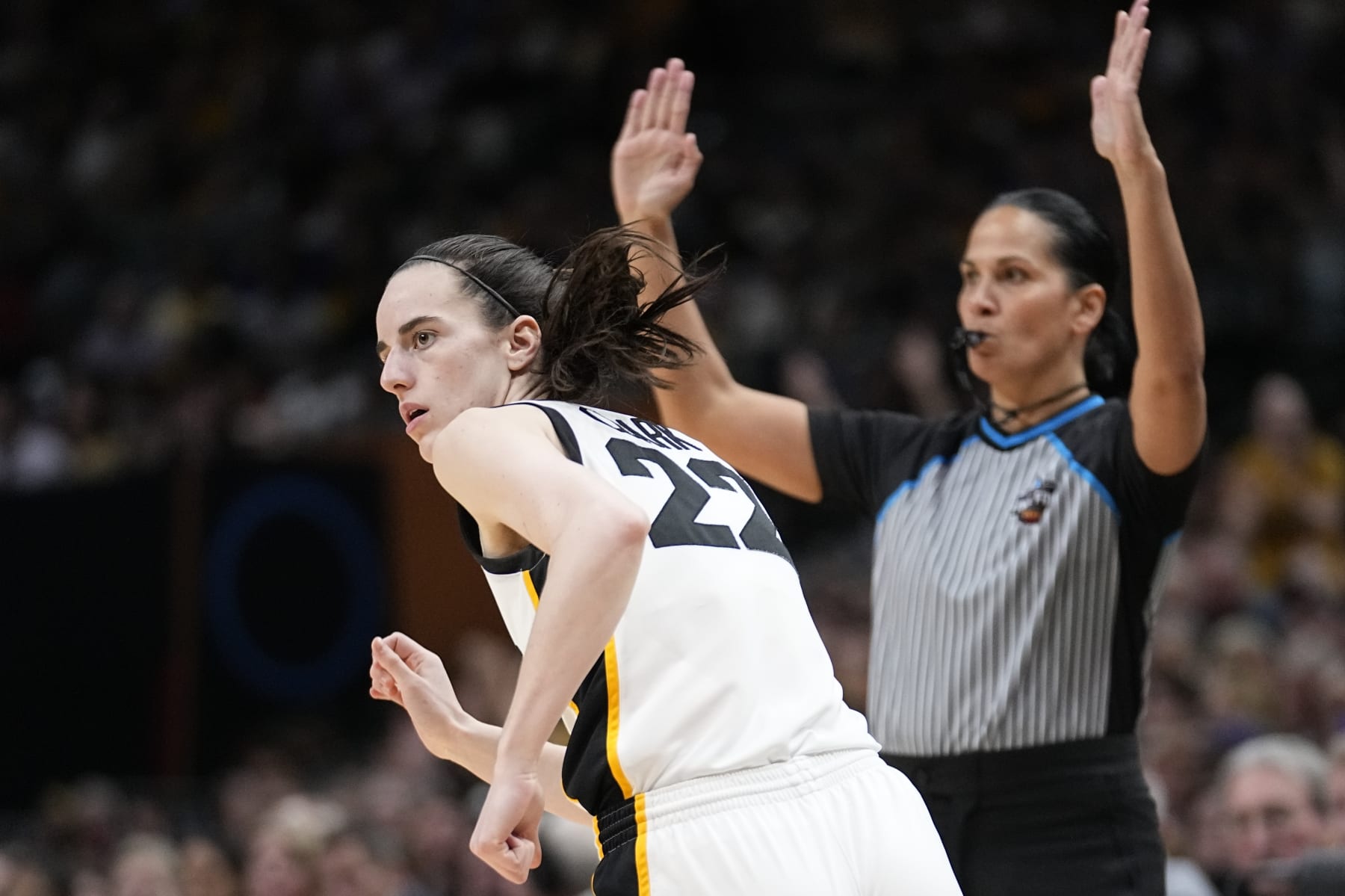 Iowa's Caitlin Clark after making a three pointer during the second half of the NCAA Women's Final Four championship basketball game against LSU Sunday, April 2, 2023, in Dallas. (AP Photo/Tony Gutierrez)
