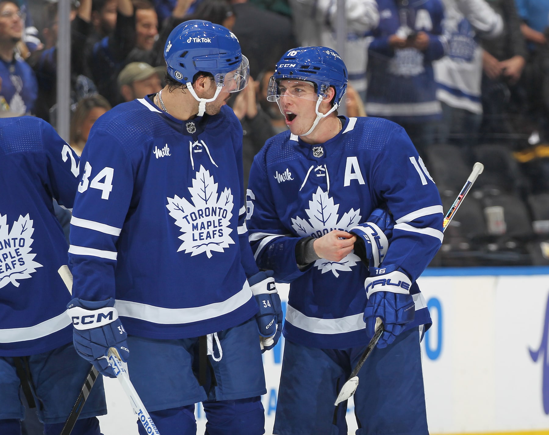 TORONTO, CANADA - JANUARY 25: Mitchell Marner #16 of the Toronto Maple Leafs celebrates his game winning goal in overtime against the New York Rangers with teammate Auston Matthews #34 during an NHL game at Scotiabank Arena on January 25, 2023 in Toronto, Ontario, Canada. The Maple Leafs defeated the Rangers 3-2 in overtime. (Photo by Claus Andersen/Getty Images)