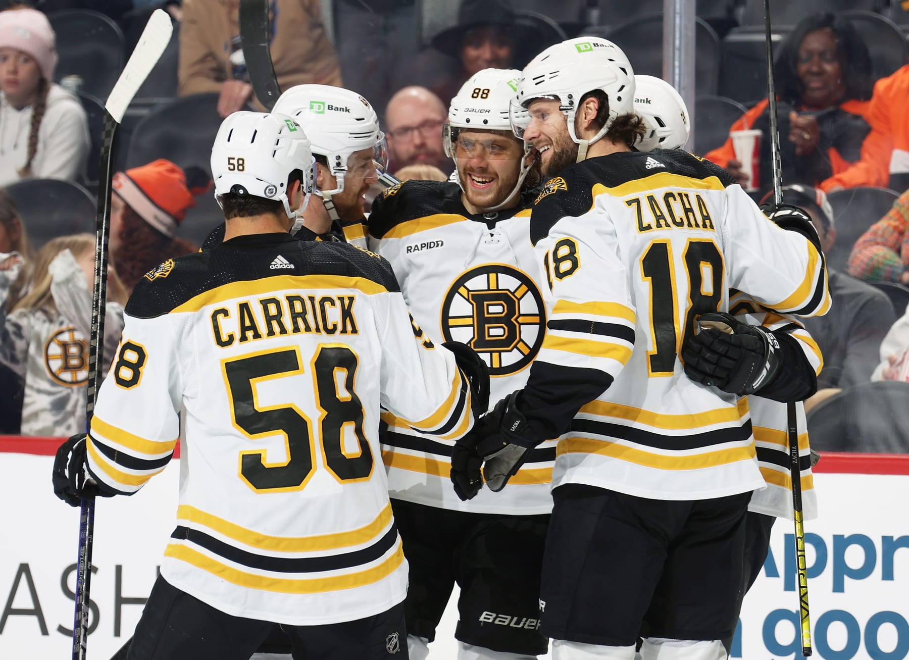 PHILADELPHIA, PENNSYLVANIA - APRIL 09: David Pastrnak #88 of the Boston Bruins celebrates the second of his two second period goals against the Philadelphia Flyers with Connor Carrick #58, Matt Grzelcyk #48, and Pavel Zacha #18 at the Wells Fargo Center on April 9, 2023 in Philadelphia, Pennsylvania.  (Photo by Len Redkoles/NHLI via Getty Images)