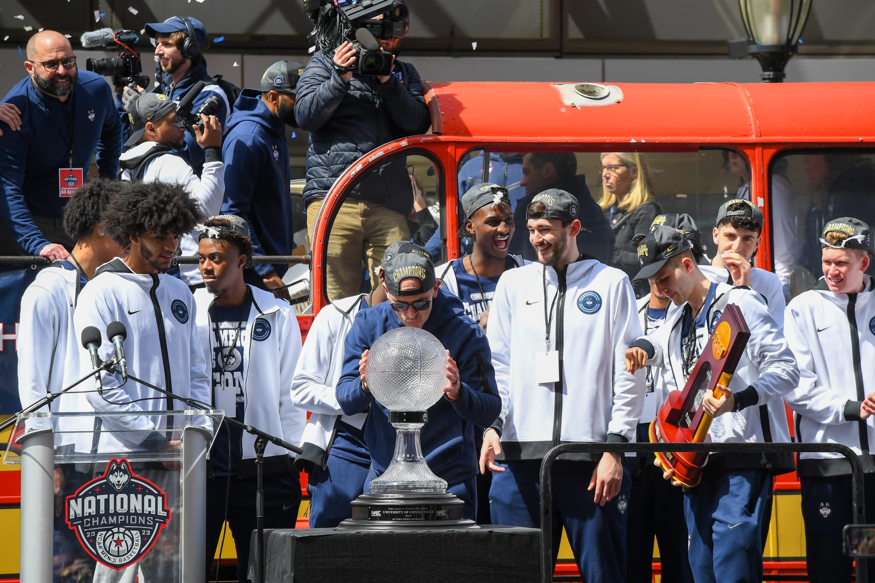 HARTFORD, CT - APRIL 08: UConn Huskies head coach Dan Hurley kisses the NABC National Championship Trophy after arriving at the rally during the UConn Championship Parade on April 8, 2023, at the XL Center in Hartford, CT. (Photo by Erica Denhoff/Icon Sportswire via Getty Images)