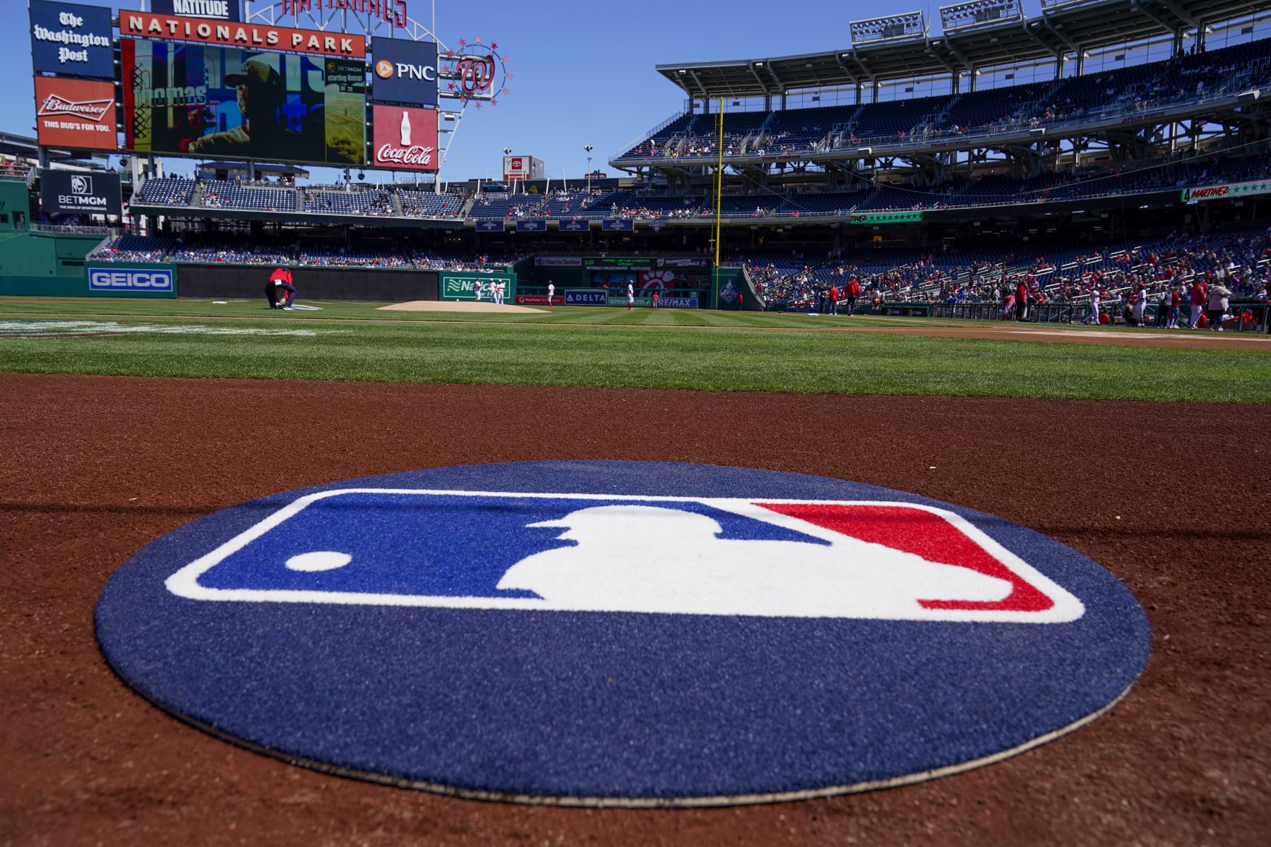 The on-deck circle with the MLB logo is in place before a baseball game between the Washington Nationals and the Atlanta Braves at Nationals Park, Sunday, April 2, 2023, in Washington. (AP Photo/Alex Brandon) The on-deck circle with the MLB logo is in place before a baseball game between the Washington Nationals and the Atlanta Braves at Nationals Park, Sunday, April 2, 2023, in Washington. (AP Photo/Alex Brandon)