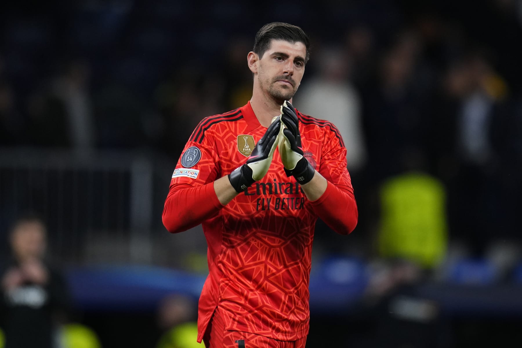 Real Madrid's goalkeeper Thibaut Courtois applauds after the Champions League quarterfinal, first leg, soccer match between Real Madrid and Chelsea at the Santiago Bernabeu stadium in Madrid, Spain, Wednesday, April 12, 2023. Real won 2-0. (AP Photo/Manu Fernandez)