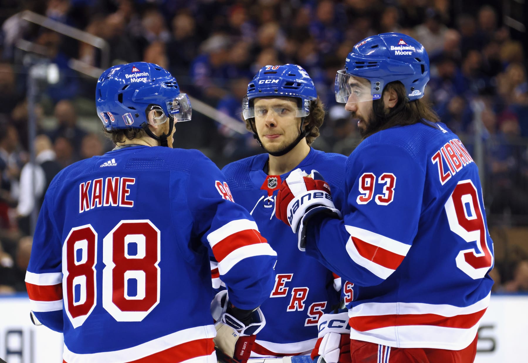 NEW YORK, NEW YORK - APRIL 24: (L-R) Patrick Kane #88, Artemi Panarin #10 and Mika Zibanejad #93 of the New York Rangers confer prior to a second period faceoff against the New Jersey Devils in Game Four of the First Round of the 2023 Stanley Cup Playoffs at Madison Square Garden on April 24, 2023 in New York, New York. (Photo by Bruce Bennett/Getty Images)