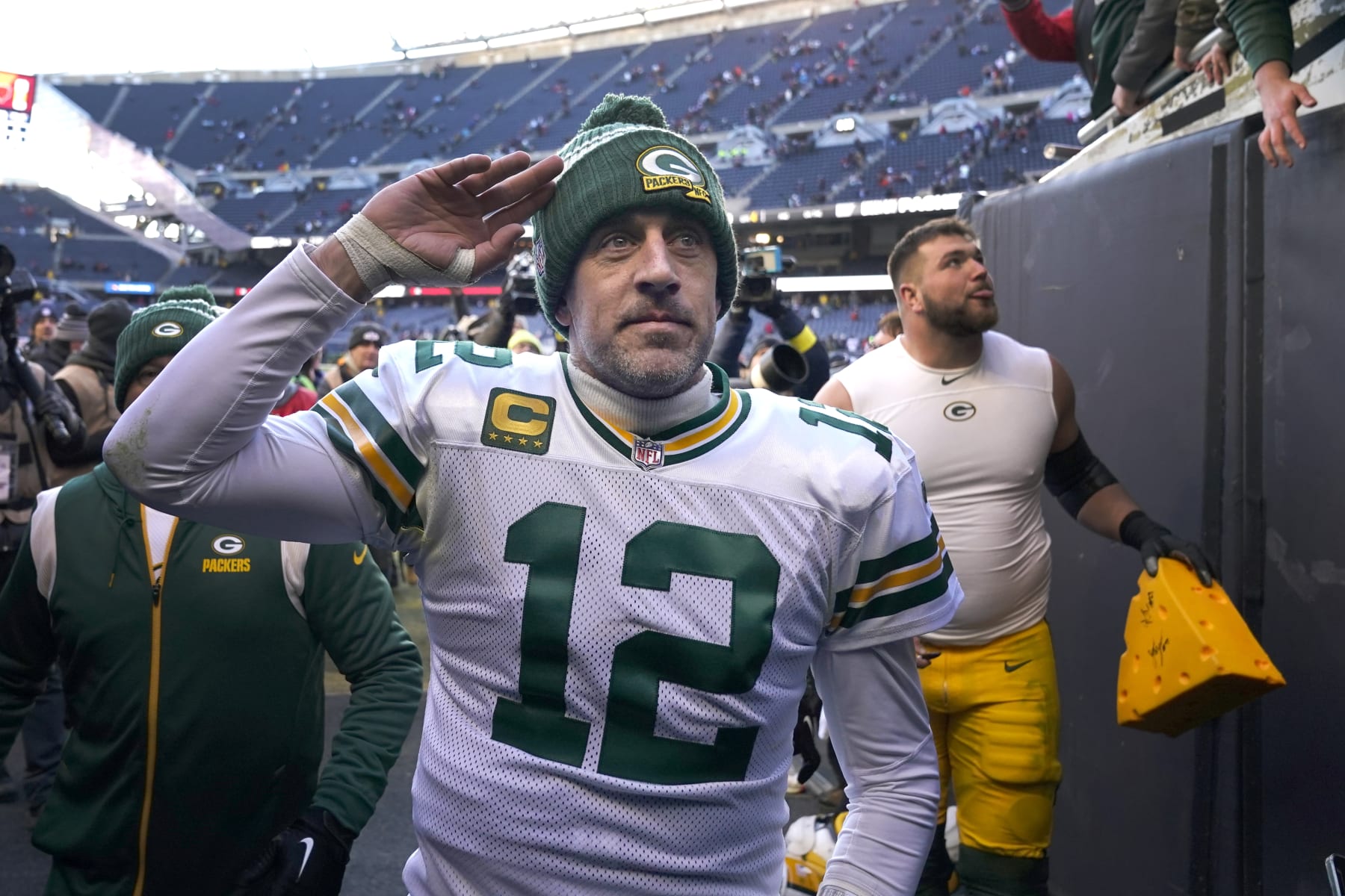 FILE - Green Bay Packers' Aaron Rodgers salutes the fans after an NFL football game against the Chicago Bears, Dec. 4, 2022, in Chicago. Rodgers is leaving behind his brilliant legacy in Green Bay and heading to the bright lights — and massive expectations — of the Big Apple. The New York Jets agreed on a deal Monday, April 24, 2023, to acquire the four-time NFL MVP from the Packers, according to a person with knowledge of the trade. The person spoke to The Associated Press on the condition of anonymity because the teams have not officially announced the deal. (AP Photo/Charles Rex Arbogast, File) FILE - Green Bay Packers' Aaron Rodgers salutes the fans after an NFL football game against the Chicago Bears, Dec. 4, 2022, in Chicago. Rodgers is leaving behind his brilliant legacy in Green Bay and heading to the bright lights — and massive expectations — of the Big Apple. The New York Jets agreed on a deal Monday, April 24, 2023, to acquire the four-time NFL MVP from the Packers, according to a person with knowledge of the trade. The person spoke to The Associated Press on the condition of anonymity because the teams have not officially announced the deal. (AP Photo/Charles Rex Arbogast, File)