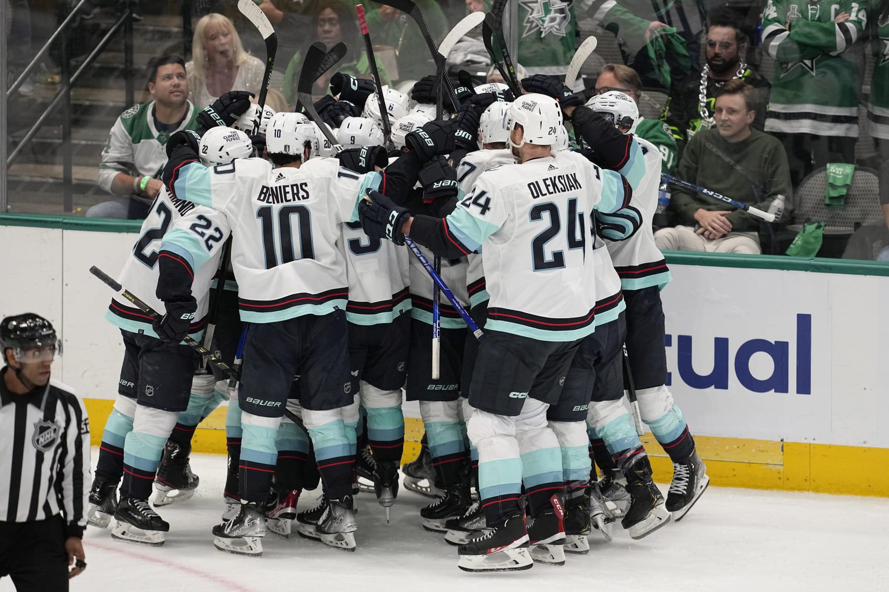 The Seattle Kraken celebrate after Yanni Gourde scored in overtime of Game 1 of an NHL hockey Stanley Cup second-round playoff series against the Dallas Stars, Tuesday, May 2, 2023, in Dallas. The Kraken won 5-4. (AP Photo/Tony Gutierrez)