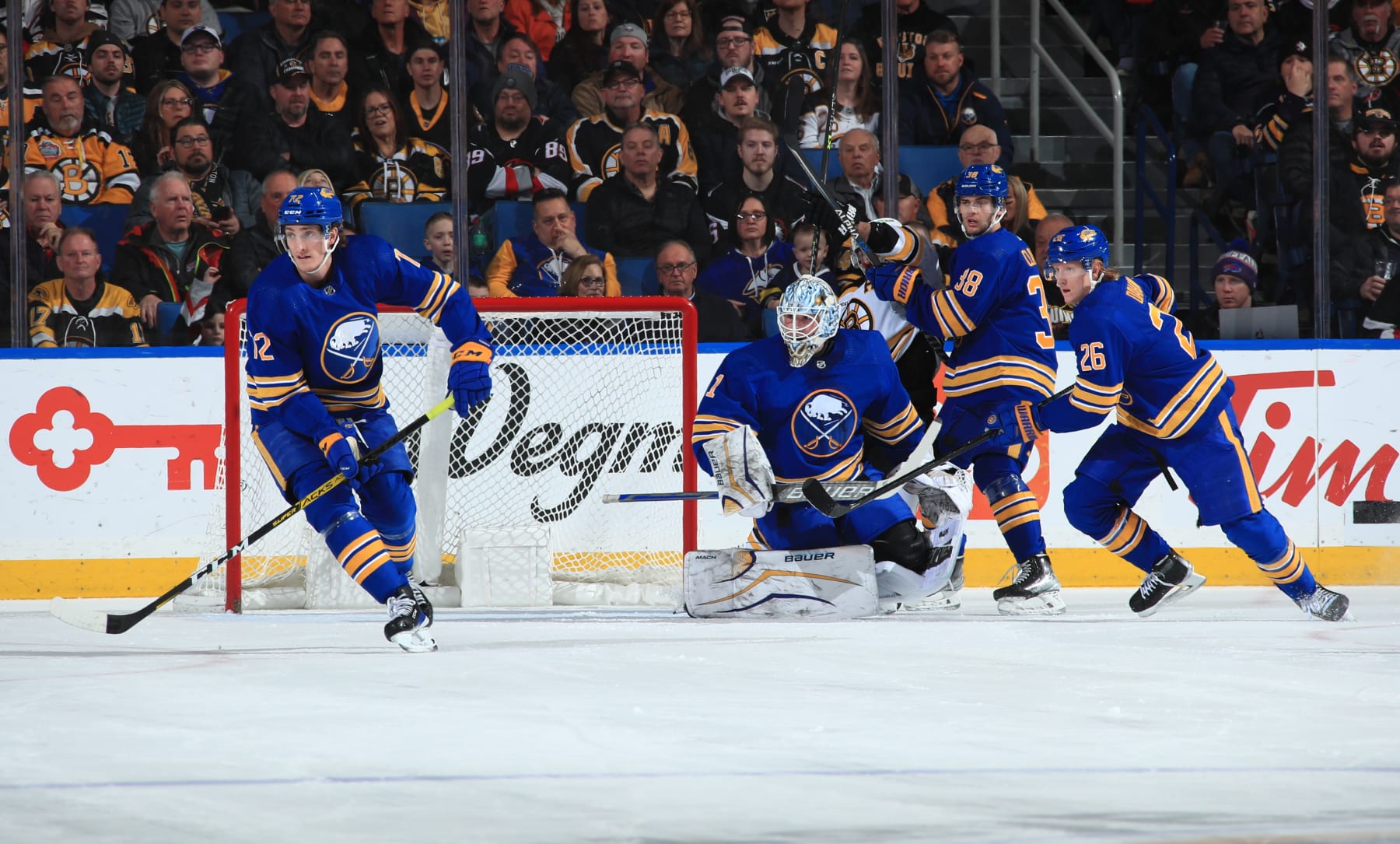 BUFFALO, NY - MARCH 19: Tage Thompson #72, Ukko-Pekka Luukkonen #1, Kale Clague #38 and Rasmus Dahlin #26 of the Buffalo Sabres defend against the Boston Bruins during an NHL game on March 19, 2023 at KeyBank Center in Buffalo, New York. (Photo by Bill Wippert/NHLI via Getty Images)