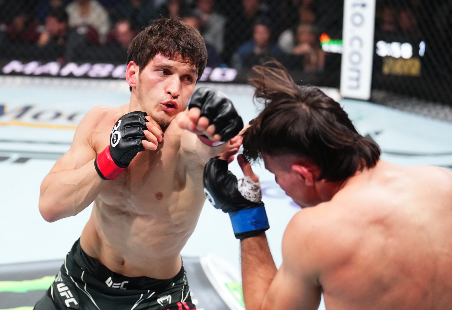 NEWARK, NEW JERSEY - MAY 06: (L-R) Movsar Evloev of Russia punches Diego Lopes of Brazil in a featherweight fight during the UFC 288 event at Prudential Center on May 06, 2023 in Newark, New Jersey. (Photo by Chris Unger/Zuffa LLC via Getty Images) NEWARK, NEW JERSEY - MAY 06: (L-R) Movsar Evloev of Russia punches Diego Lopes of Brazil in a featherweight fight during the UFC 288 event at Prudential Center on May 06, 2023 in Newark, New Jersey. (Photo by Chris Unger/Zuffa LLC via Getty Images)