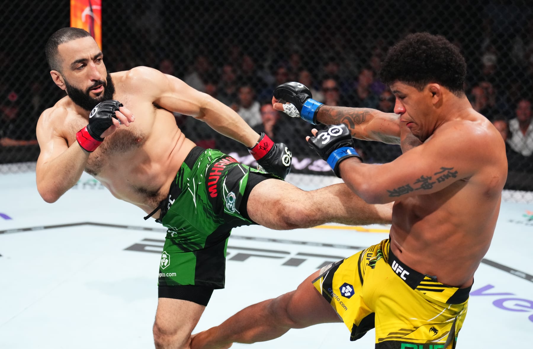 NEWARK, NEW JERSEY - MAY 06: (L-R) Belal Muhammad kicks Gilbert Burns of Brazil in a welterweight fight during the UFC 288 event at Prudential Center on May 06, 2023 in Newark, New Jersey. (Photo by Chris Unger/Zuffa LLC via Getty Images)