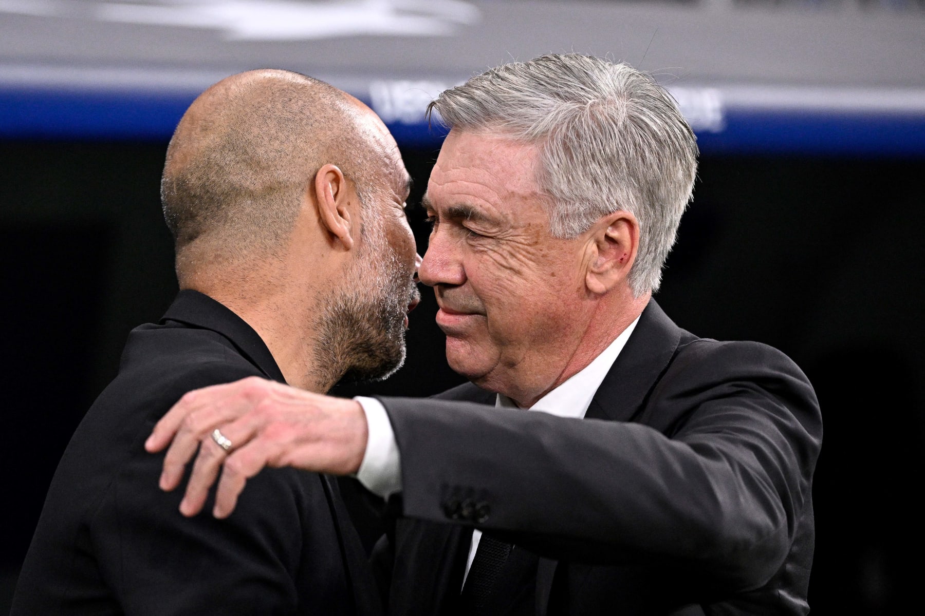 Manchester City's Spanish manager Pep Guardiola (L) and Real Madrid's Italian coach Carlo Ancelotti hug prior the UEFA Champions League semi-final first leg football match between Real Madrid CF and Manchester City at the Santiago Bernabeu stadium in Madrid on May 9, 2023. (Photo by JAVIER SORIANO / AFP) (Photo by JAVIER SORIANO/AFP via Getty Images)