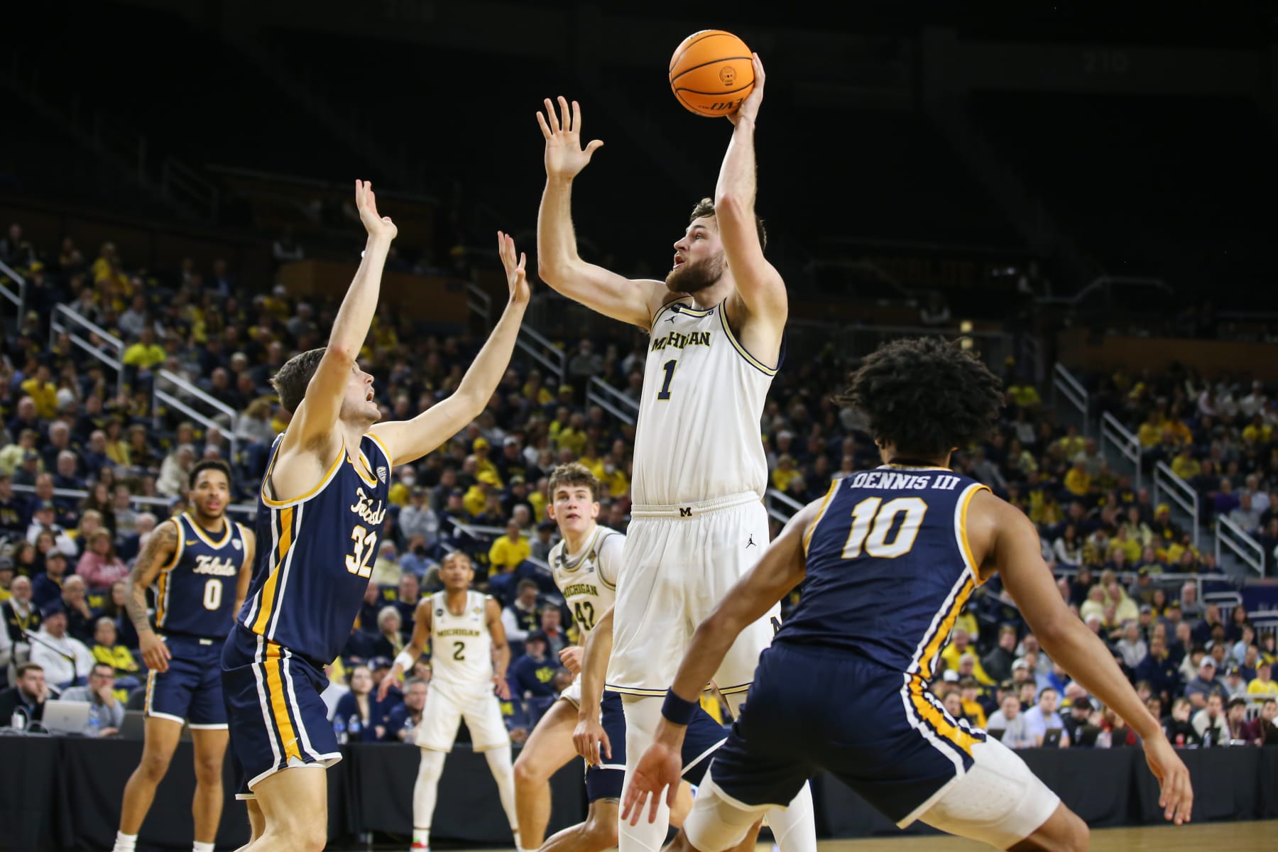 ANN ARBOR, MI - MARCH 14:  Michigan Wolverines center Hunter Dickinson (1) shoots over Toledo Rockets forward JT Shumate (32) during the first half a first round college basketball game of the National Invitational Tournament between the Toledo Rockets and the Michigan Wolverines on March 14, 2023 at the Crisler Center in Ann Arbor, Michigan.  (Photo by Scott W. Grau/Icon Sportswire via Getty Images)