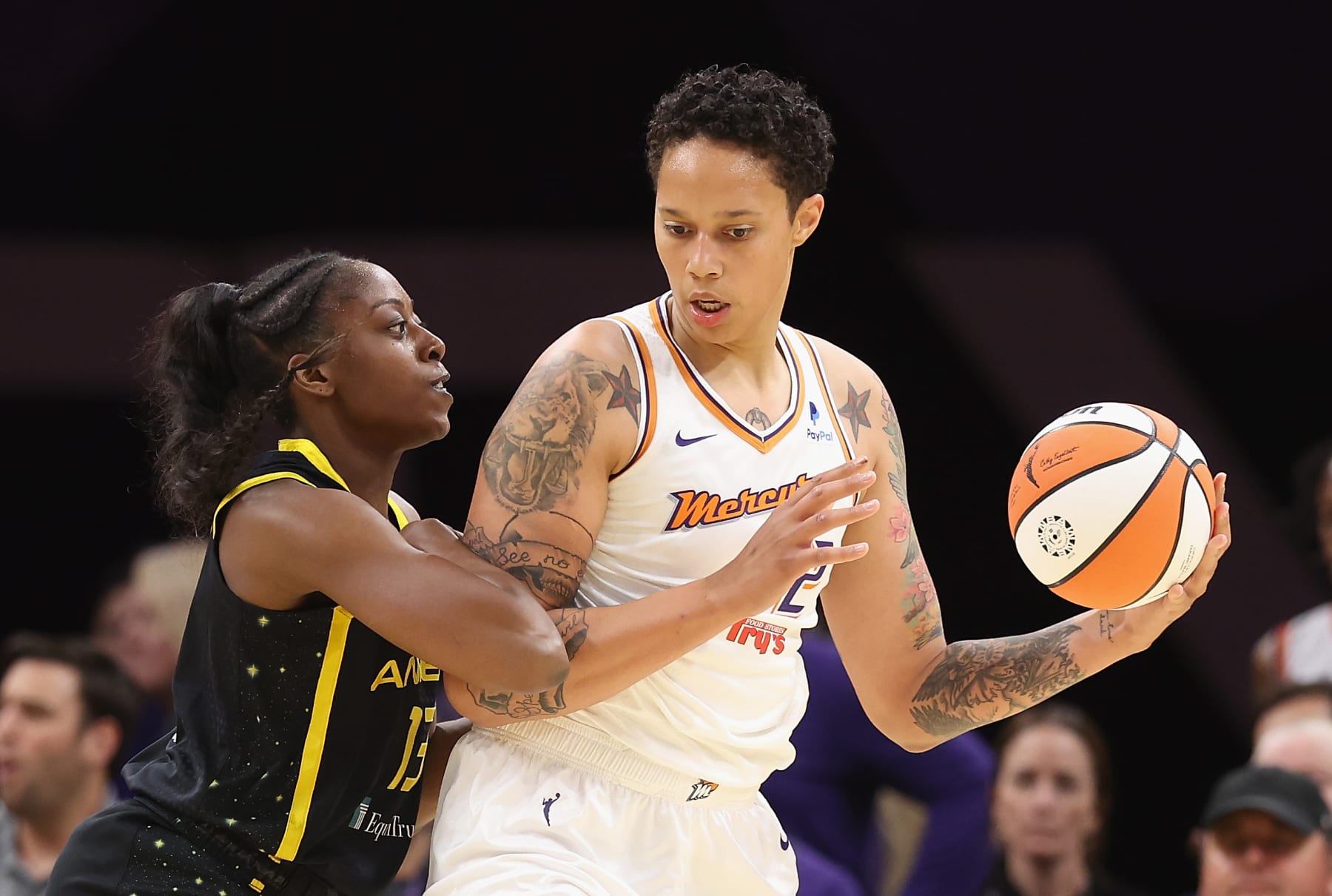 PHOENIX, ARIZONA - MAY 12:  Brittney Griner #42 of the Phoenix Mercury handles the ball against Chiney Ogwumike #13 of the Los Angeles Sparks during the first half of the WNBA game at Footprint Center on May 12, 2023 in Phoenix, Arizona. NOTE TO USER: User expressly acknowledges and agrees that, by downloading and or using this photograph, User is consenting to the terms and conditions of the Getty Images License Agreement.  (Photo by Christian Petersen/Getty Images)