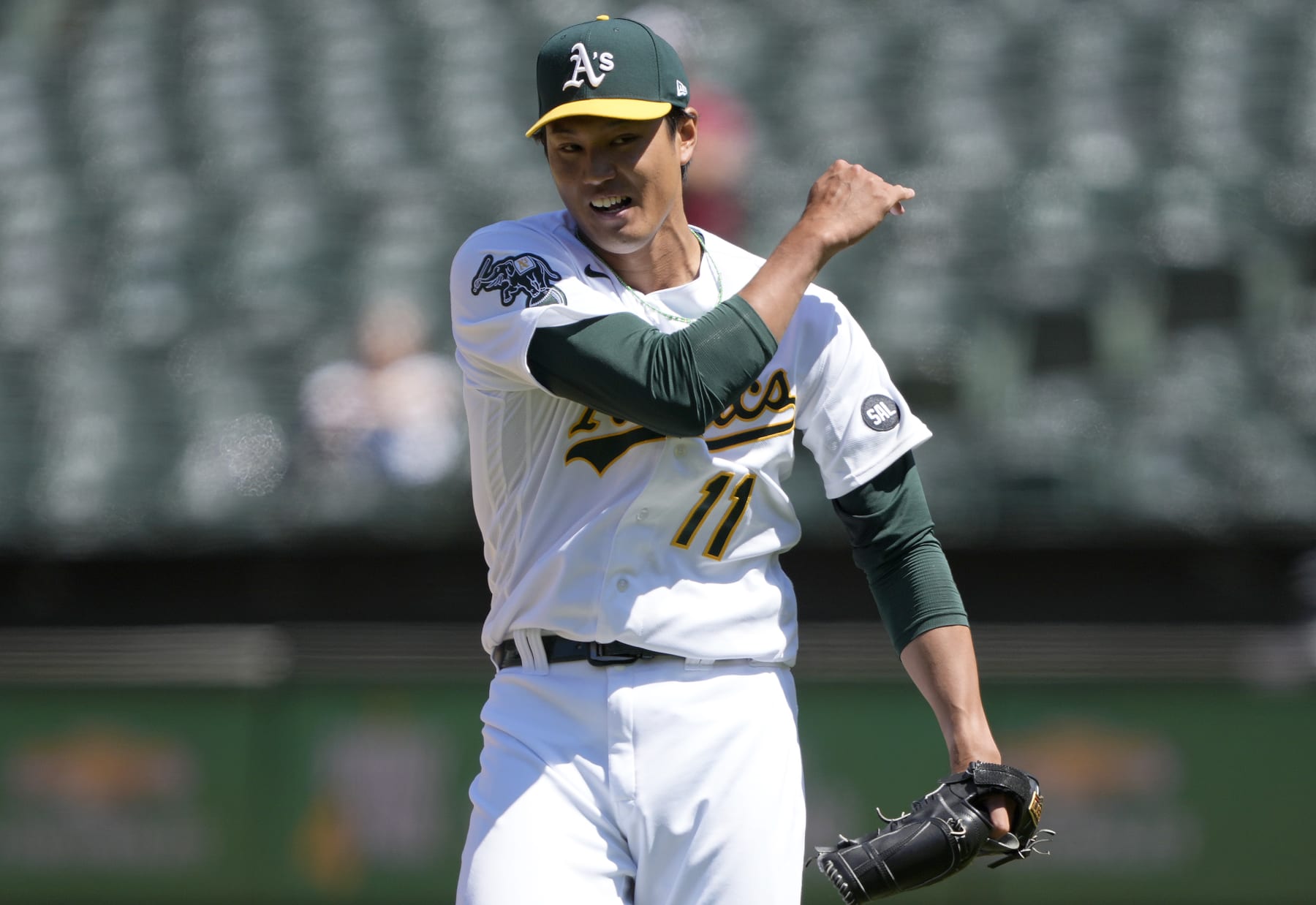 Shintaro Fujinami (L) of the Oakland Athletics and Masataka