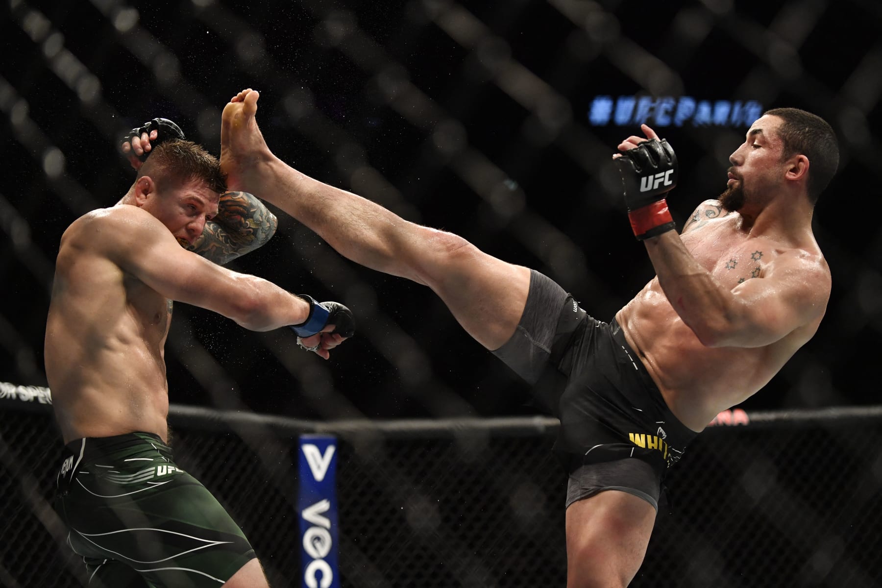 New Zeland's Robert Whittaker (R) competes against Italy's Marvin Vettori in their men's heavyweight fight during the Ultimate Fighting Championship (UFC) Fight Night 209 event at the Paris-Bercy arena in Paris on September 3, 2022. (Photo by JULIEN DE ROSA / AFP) (Photo by JULIEN DE ROSA/AFP via Getty Images)