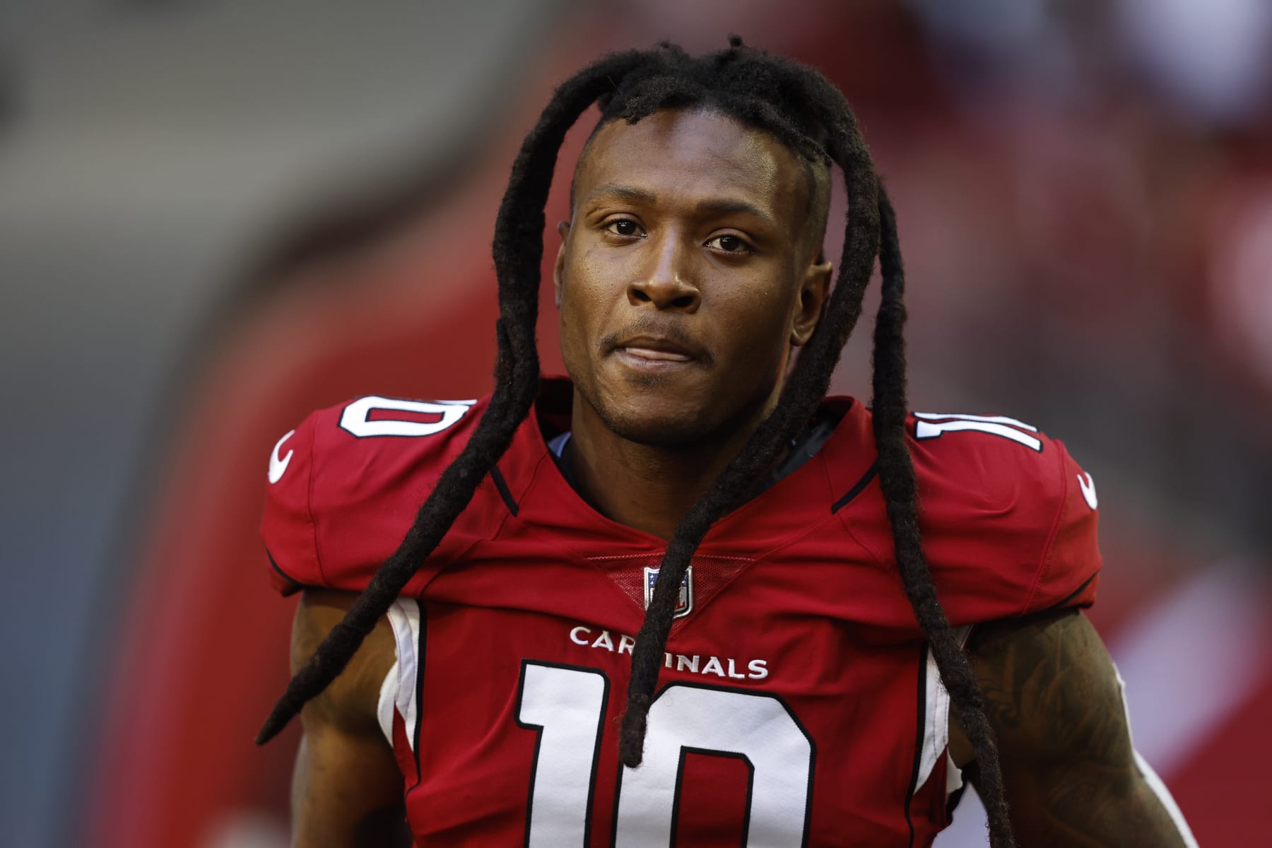 GLENDALE, ARIZONA - NOVEMBER 06: DeAndre Hopkins #10 of the Arizona Cardinals looks on as he takes the field prior to an NFL Football game between the Arizona Cardinals and the Seattle Seahawks at State Farm Stadium on November 06, 2022 in Glendale, Arizona. (Photo by Michael Owens/Getty Images)