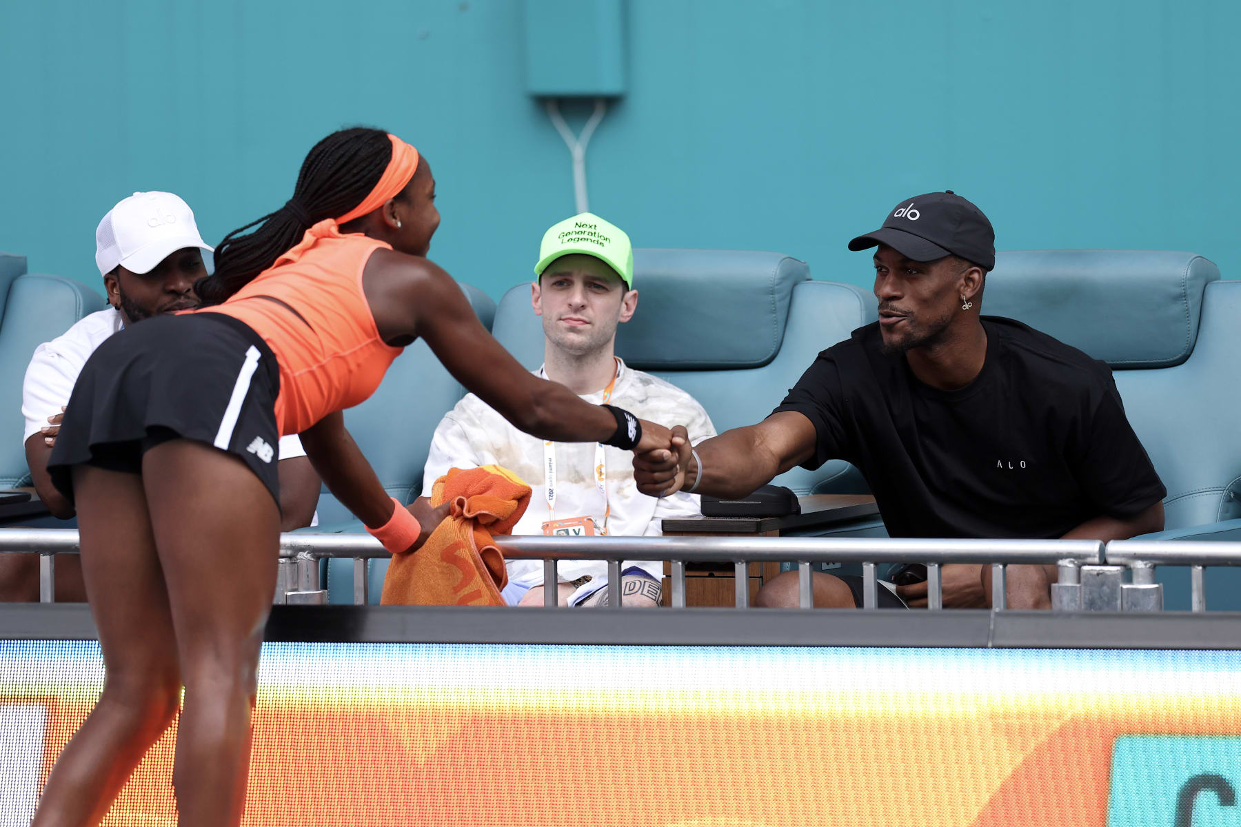 MIAMI GARDENS, FLORIDA - MARCH 23: Jimmy Butler of the Miami Heat greets Coco Gauff of the United States during the Miami Open held at Hard Rock Stadium on March 23, 2023 in Miami Gardens, Florida. (Photo by Tim Nwachukwu/Getty Images)