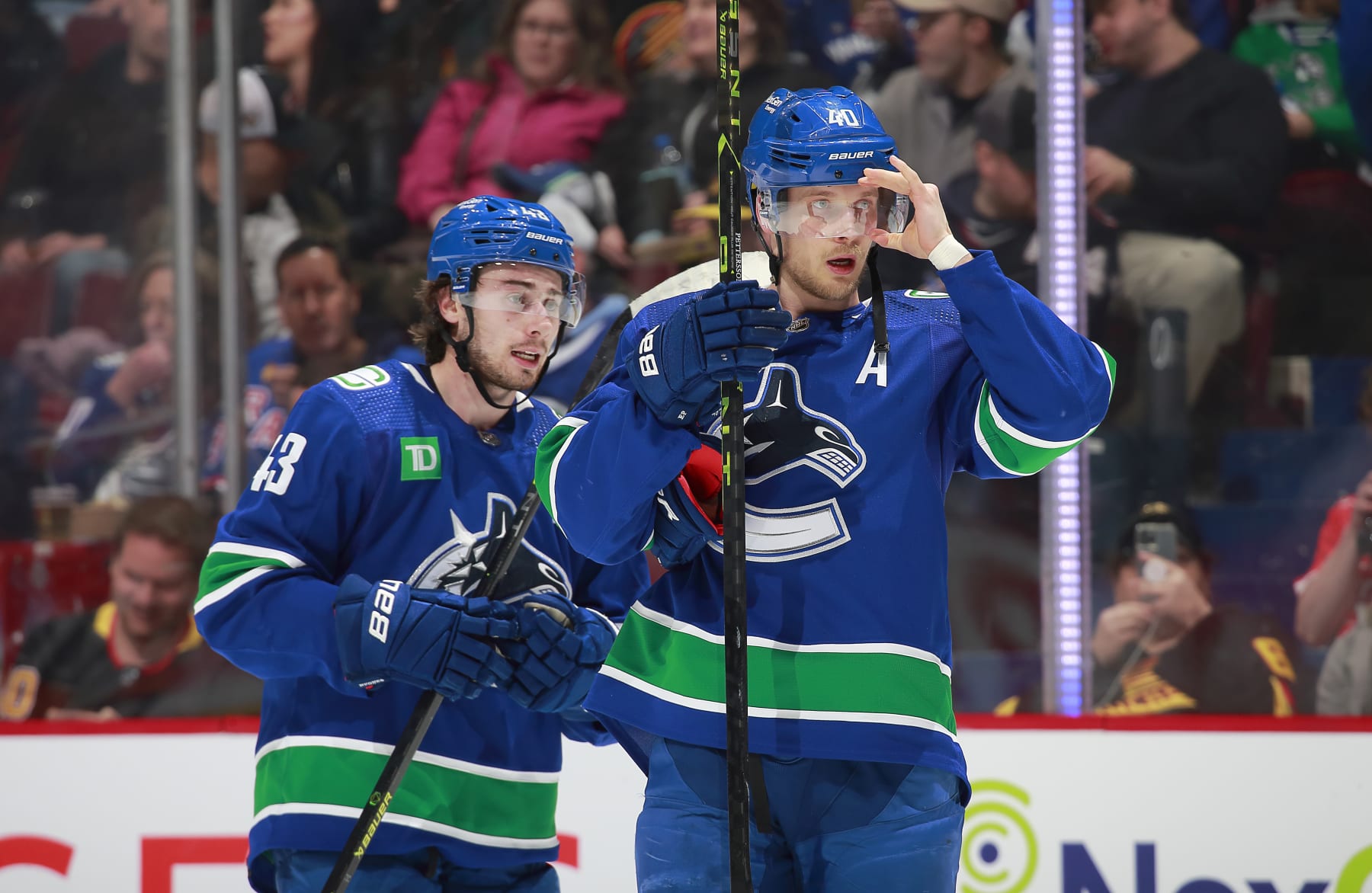 VANCOUVER, CANADA - FEBRUARY 15: Quinn Hughes #43 andElias Pettersson #40 of the Vancouver Canucks skate up ice during their NHL game against the New York Rangers at Rogers Arena February 15, 2023 in Vancouver, British Columbia, Canada. (Photo by Jeff Vinnick/NHLI via Getty Images)