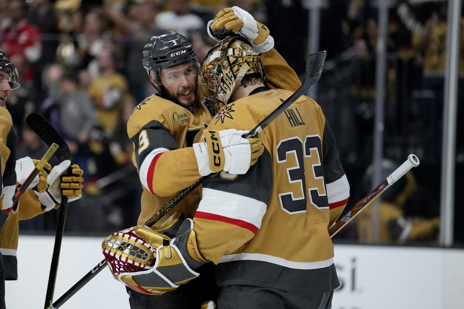 Vegas Golden Knights goaltender Adin Hill (33) and defenseman Brayden McNabb (3) celebrate after Game 2 of the NHL hockey Stanley Cup Finals against the Florida Panthers, Monday, June 5, 2023, in Las Vegas. The Golden Knights defeated the Panthers 7-2 to take a 2-0 series lead. (AP Photo/John Locher)