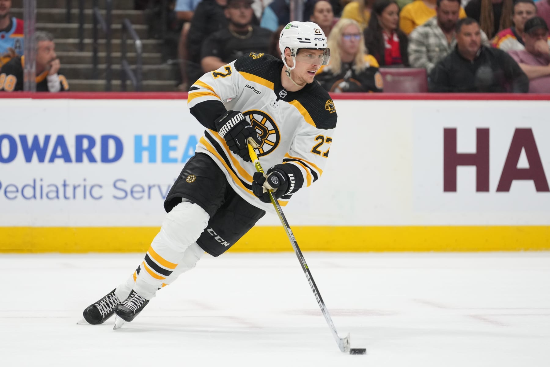 SUNRISE, FL - APRIL 23: Boston Bruins defenseman Hampus Lindholm (27) brings the puck forward during a power play in the second period during game six of the first round of the Eastern Conference Playoffs between the Boston Bruins and the Florida Panthers on Friday, April 28, 2023 at FLA Live Arena in Sunrise, Fla (Photo by Peter Joneleit/Icon Sportswire via Getty Images)