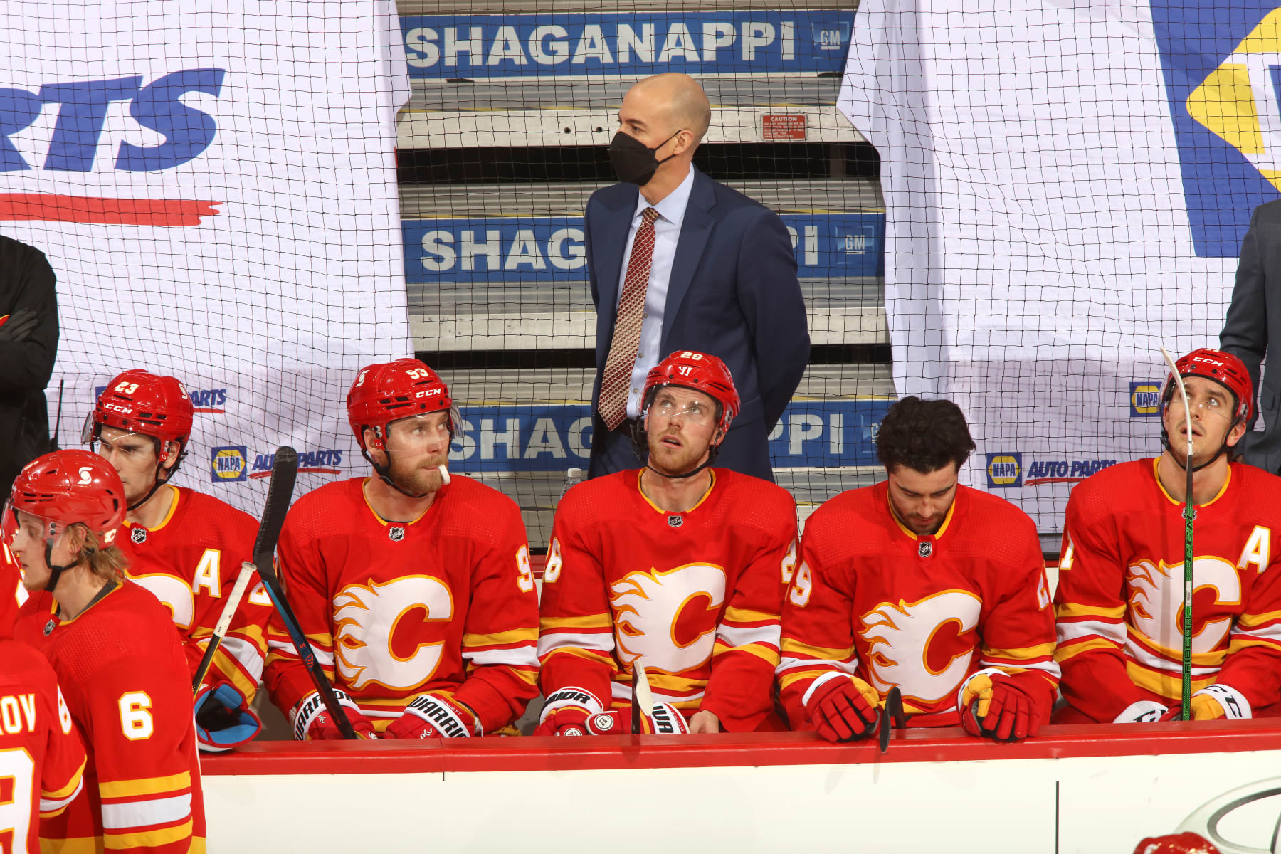 CALGARY, ALBERTA - MARCH 07: Interim Head Coach Ryan Huska of the Calgary Flames watches from the bench against the Ottawa Senators at Scotiabank Saddledome on March 07, 2021 in Calgary, Alberta. (Photo by Gerry Thomas/NHLI via Getty Images)