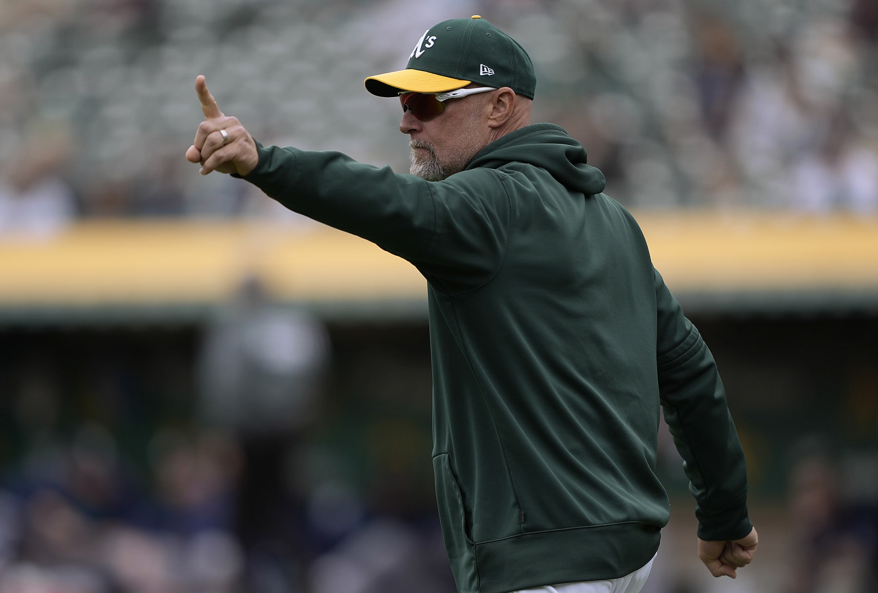 OAKLAND, CALIFORNIA - MAY 04: Manager Mark Kotsay #7 of the Oakland Athletics signals the bullpen to make a pitching change against the Seattle Mariners in the top of the fourth inning at RingCentral Coliseum on May 04, 2023 in Oakland, California. (Photo by Thearon W. Henderson/Getty Images)