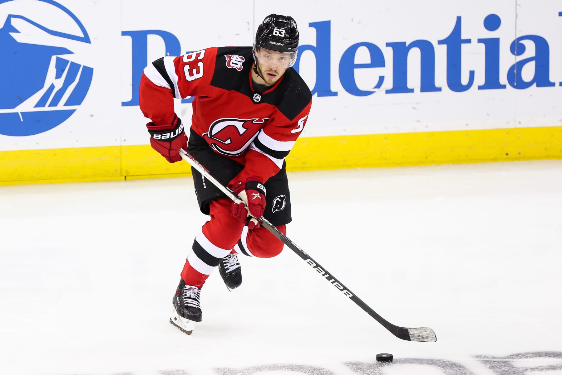 NEWARK, NJ - MAY 09: New Jersey Devils left wing Jesper Bratt (63) skates with the puck during Game 4 of an Eastern Conference Second Round playoff game between the Carolina Hurricanes and the New Jersey Devils on May 9, 2023, at Prudential Center in Newark, New Jersey. (Photo by Andrew Mordzynski/Icon Sportswire via Getty Images)