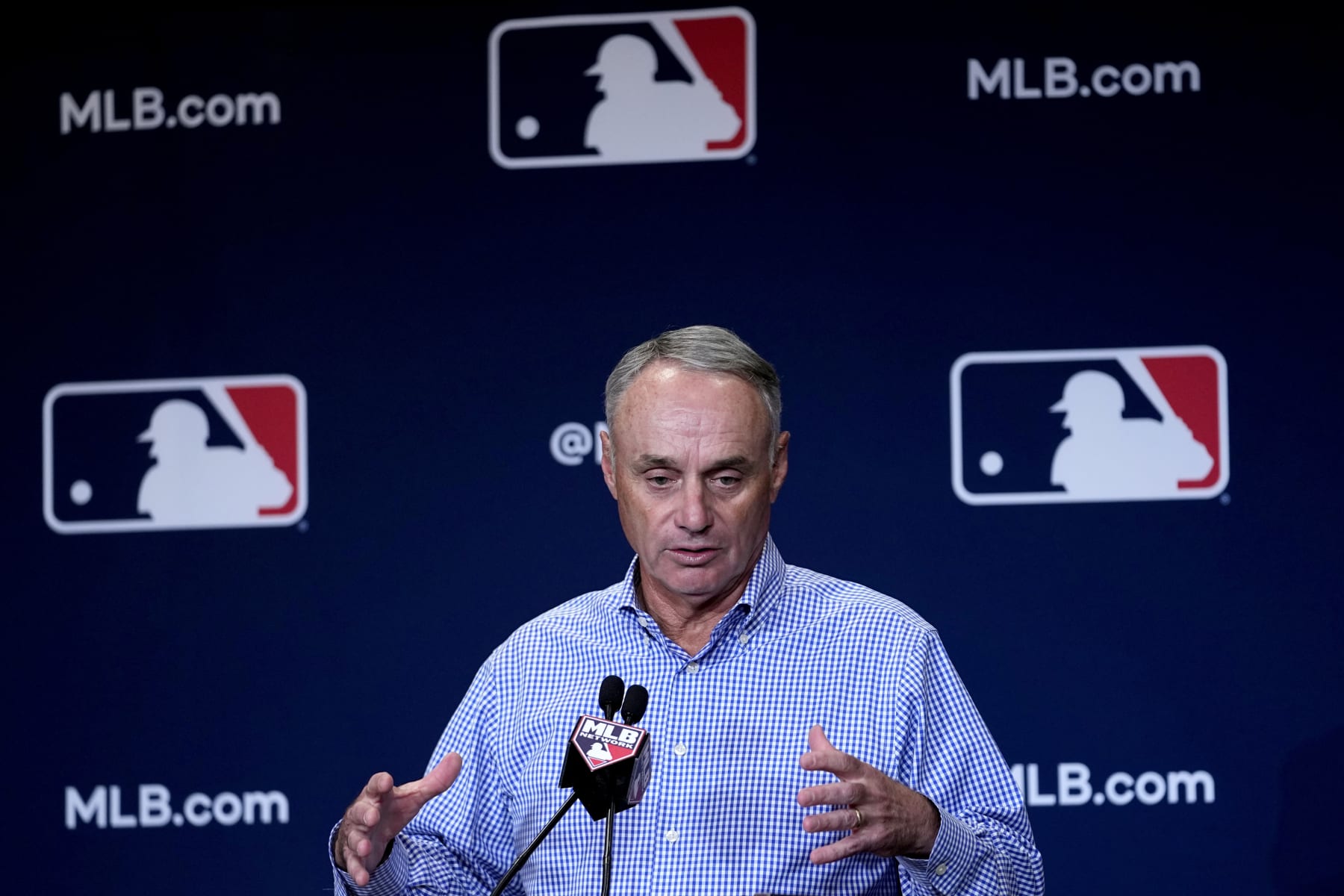 Major League Baseball Commissioner Robert D. Manfred, Jr. speaks, Wednesday, Feb. 15, 2023, during the spring training media day in Phoenix. (AP Photo/Matt York)