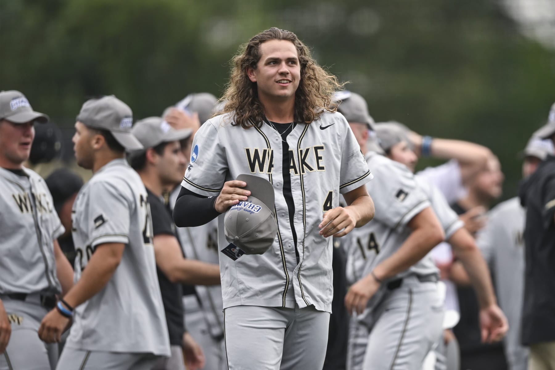 Wake Forest pitcher Rhett Lowder (4) looks on after winning an NCAA college baseball tournament super regional game against Alabama on Sunday, June 11, 2023, in Winston-Salem, N.C. (AP Photo/Matt Kelley)