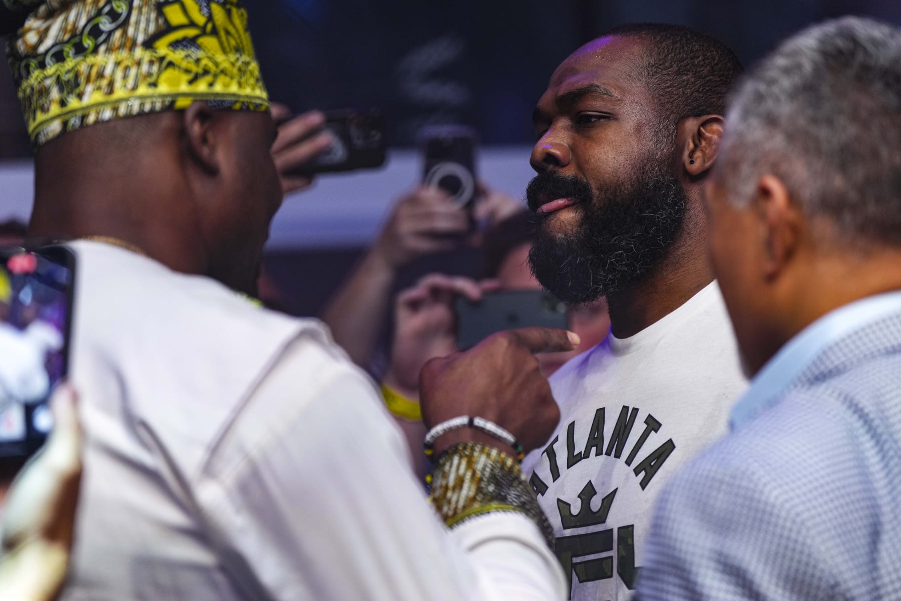 ATLANTA, GA - JUNE 17: Jon Jones has words with Francis Ngannou during PFL 2023 week 5 at OTE Arena on June 17, 2023 in Atlanta, Georgia. (Photo by Cooper Neill/Getty Images)