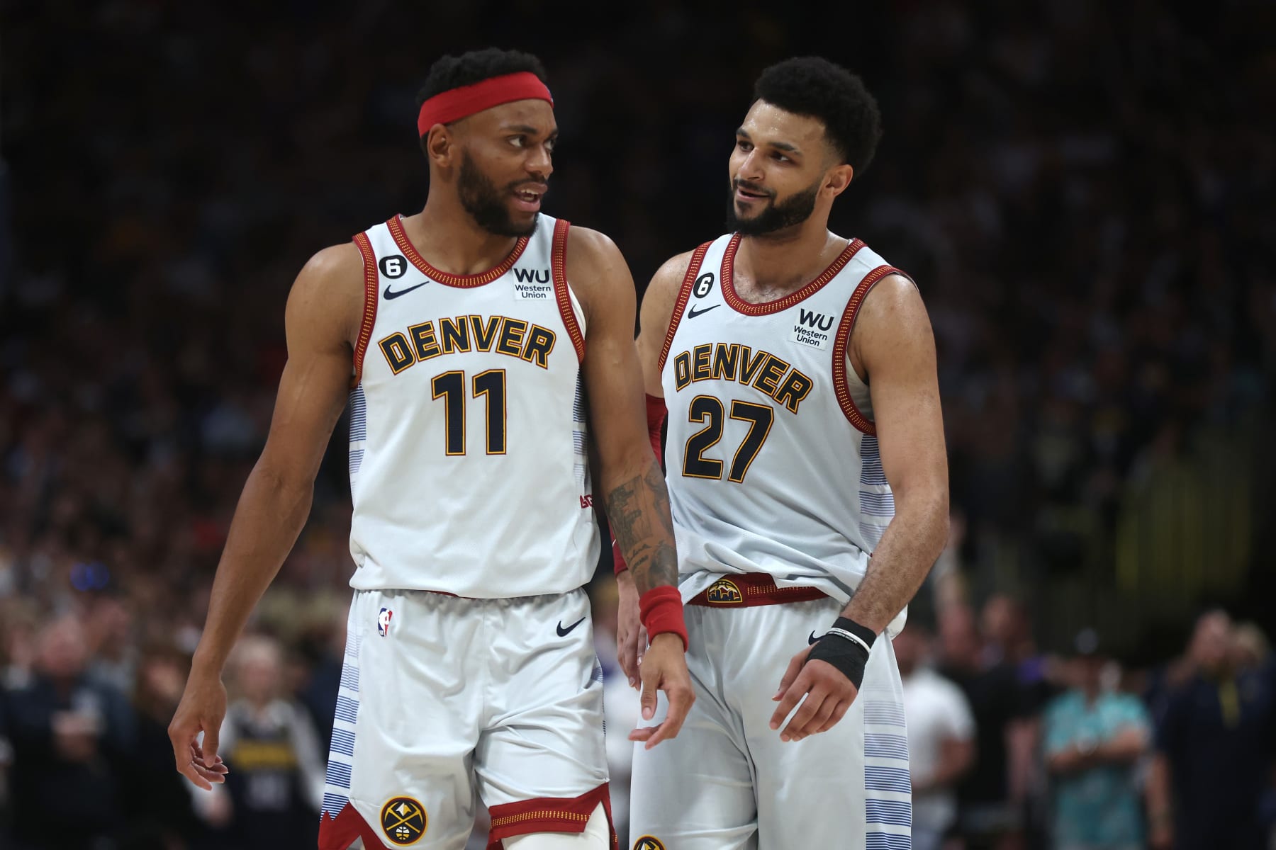 DENVER, COLORADO - JUNE 12: Jamal Murray #27 and Bruce Brown #11 of the Denver Nuggets react during the fourth quarter against the Miami Heat in Game Five of the 2023 NBA Finals at Ball Arena on June 12, 2023 in Denver, Colorado. NOTE TO USER: User expressly acknowledges and agrees that, by downloading and or using this photograph, User is consenting to the terms and conditions of the Getty Images License Agreement. (Photo by Matthew Stockman/Getty Images)