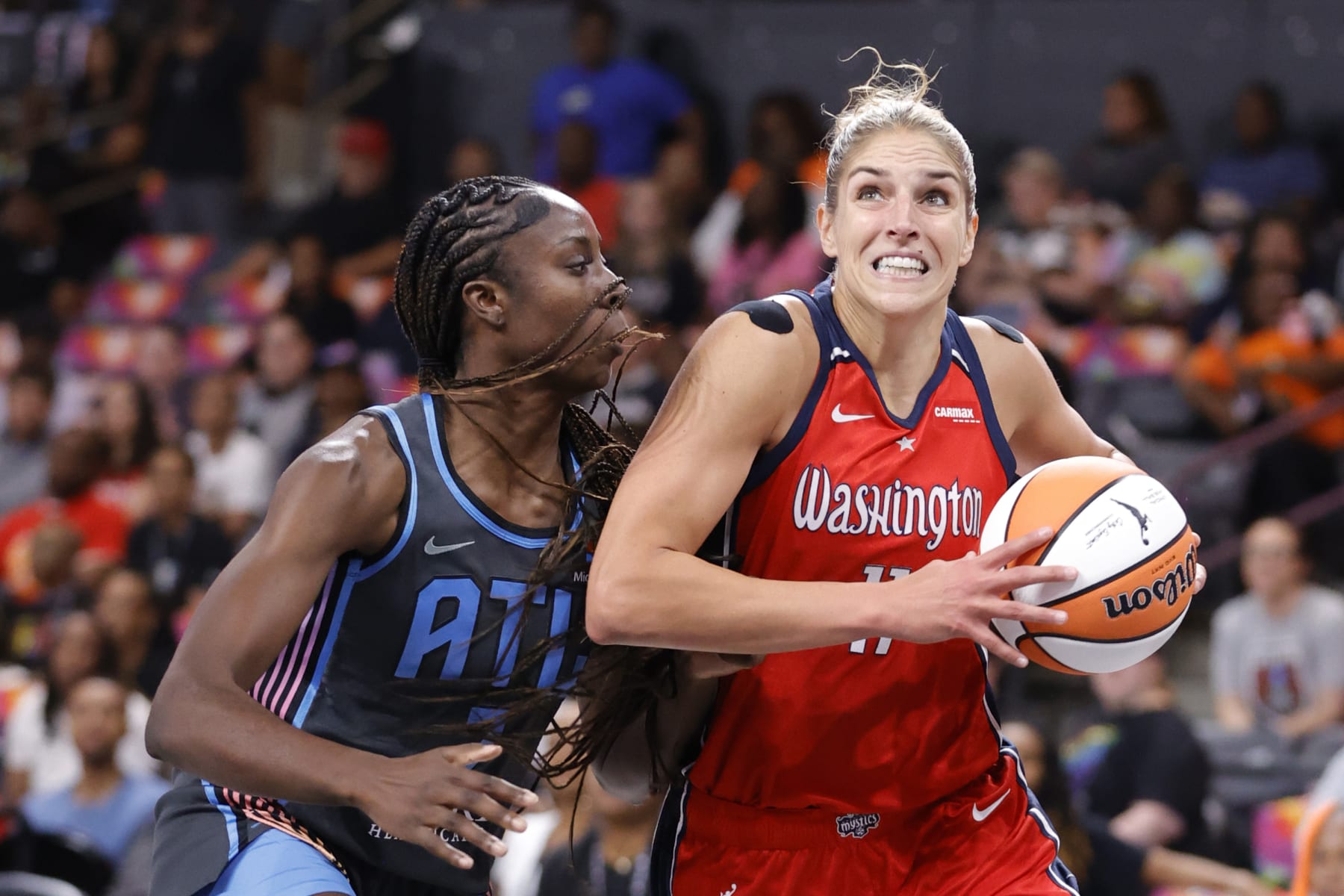 COLLEGE PARK, GEORGIA - JUNE 30: Elena Delle Donne #11 of the Washington Mystics drives against Laeticia Amihere #7 of the Atlanta Dream during the first half at Gateway Center Arena on June 30, 2023 in College Park, Georgia. NOTE TO USER: User expressly acknowledges and agrees that, by downloading and or using this photograph, User is consenting to the terms and conditions of the Getty Images License Agreement. (Photo by Alex Slitz/Getty Images)