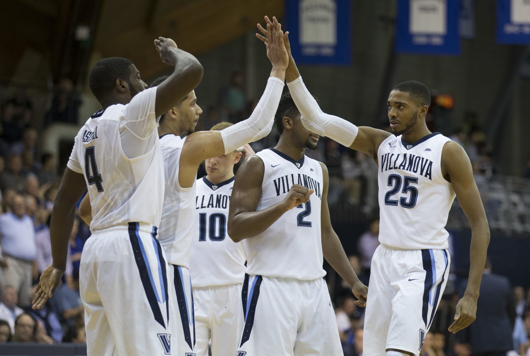 PHILADELPHIA, PA - FEBRUARY 25: Eric Paschall #4, Josh Hart #3, Donte DiVincenzo #10, Kris Jenkins #2, and Mikal Bridges #25 of the Villanova Wildcats celebrate in the second half against the Creighton Bluejays at the Pavilion on February 25, 2017 in Villanova, Pennsylvania. The Wildcats defeated the Bluejays 79-63. (Photo by Mitchell Leff/Getty Images)