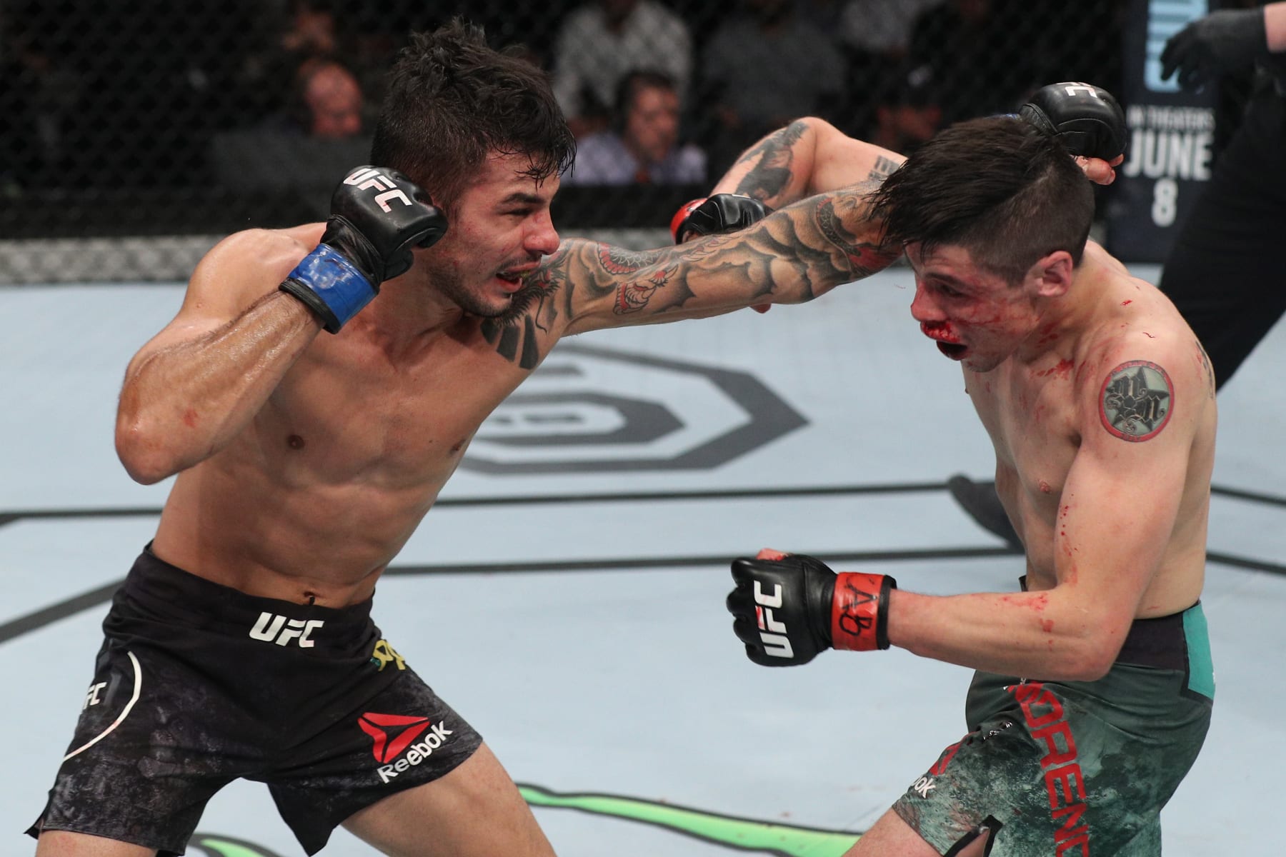 Alexandre Pantoja (left) and Brandon Moreno (right) in their 2018 fight.