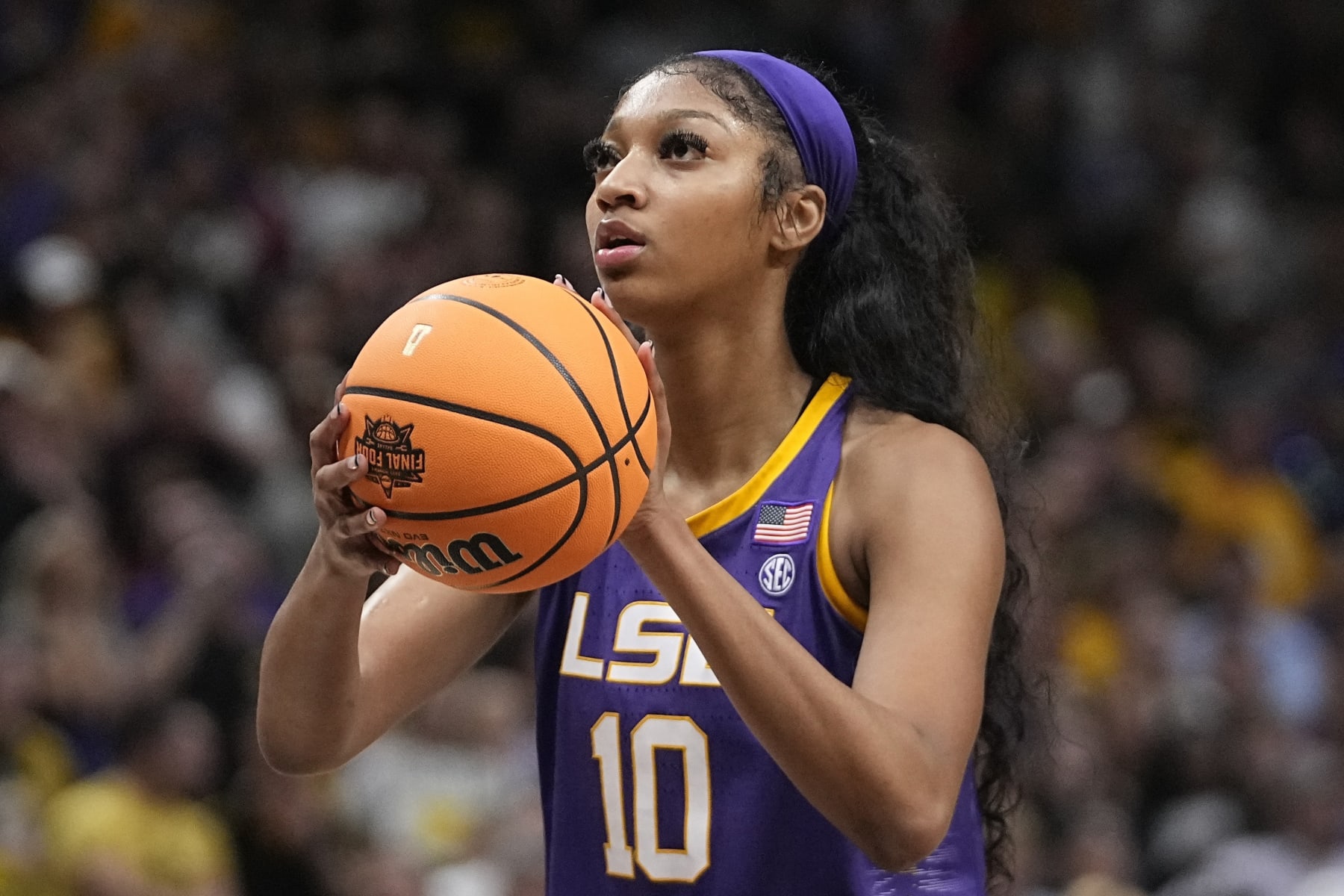 FILE - LSU's Angel Reese during the second half of the NCAA Women's Final Four championship basketball game against Iowa Sunday, April 2, 2023, in Dallas. After the Tigers won the championship earlier this year, first lady Jill Biden made an offhand suggestion that a second invitation should also be extended to the team they defeated, the University of Iowa Hawkeyes. “At the beginning we were hurt. It was emotional for us," Reese told ESPN in a subsequent interview. "Because we know how hard we worked all year for everything.” (AP Photo/Darron Cummings, File)