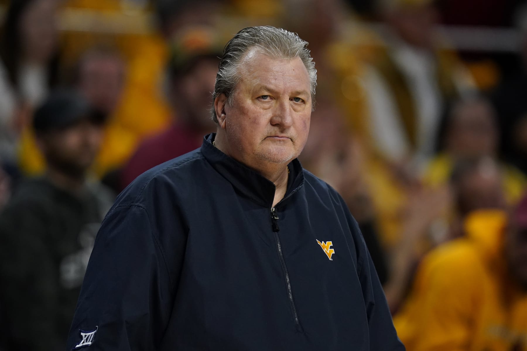 West Virginia head coach Bob Huggins watches from the bench during the first half of an NCAA college basketball game against Iowa State, Monday, Feb. 27, 2023, in Ames, Iowa. (AP Photo/Charlie Neibergall)