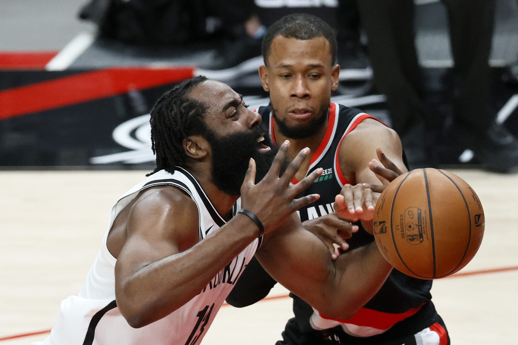 PORTLAND, OREGON - MARCH 23: James Harden #13 of the Brooklyn Nets loses control of the ball while defended by Rodney Hood #5 of the Portland Trail Blazers during the first quarter at Moda Center on March 23, 2021 in Portland, Oregon. NOTE TO USER: User expressly acknowledges and agrees that, by downloading and or using this photograph, User is consenting to the terms and conditions of the Getty Images License Agreement. (Photo by Steph Chambers/Getty Images) PORTLAND, OREGON - MARCH 23: James Harden #13 of the Brooklyn Nets loses control of the ball while defended by Rodney Hood #5 of the Portland Trail Blazers during the first quarter at Moda Center on March 23, 2021 in Portland, Oregon. NOTE TO USER: User expressly acknowledges and agrees that, by downloading and or using this photograph, User is consenting to the terms and conditions of the Getty Images License Agreement. (Photo by Steph Chambers/Getty Images)