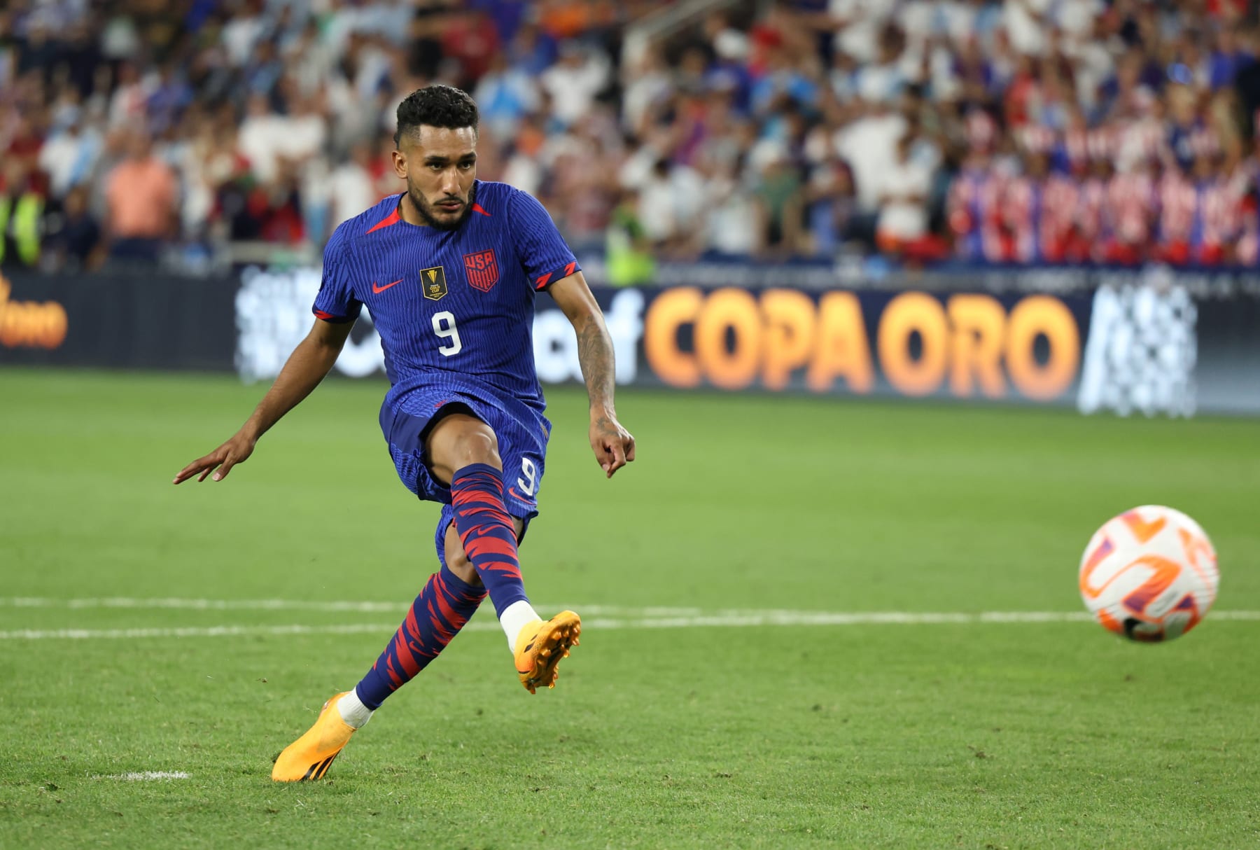 CINCINNATI, OHIO - JULY 09: Jesus Ferreira #9 of the United States scores on a penalty kick against Canada during the penalty shoot out in the Quarterfinal match in the 2023 Concacaf Gold Cup at TQL Stadium on July 09, 2023 in Cincinnati, Ohio. (Photo by Trevor Ruszkowski/USSF/Getty Images for USSF)