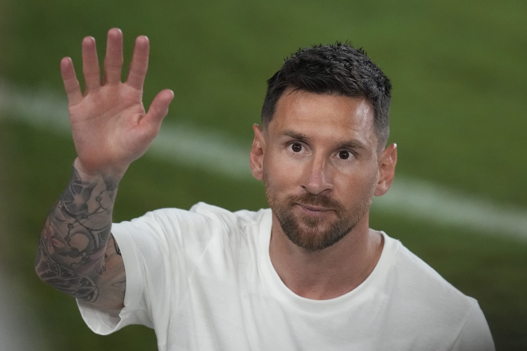 International soccer superstar Lionel Messi waves as he leaves following a celebration to present him to fans one day after his signing with the Inter Miami MLS soccer team, Sunday, July 16, 2023, in Fort Lauderdale, Fla. (AP Photo/Rebecca Blackwell)