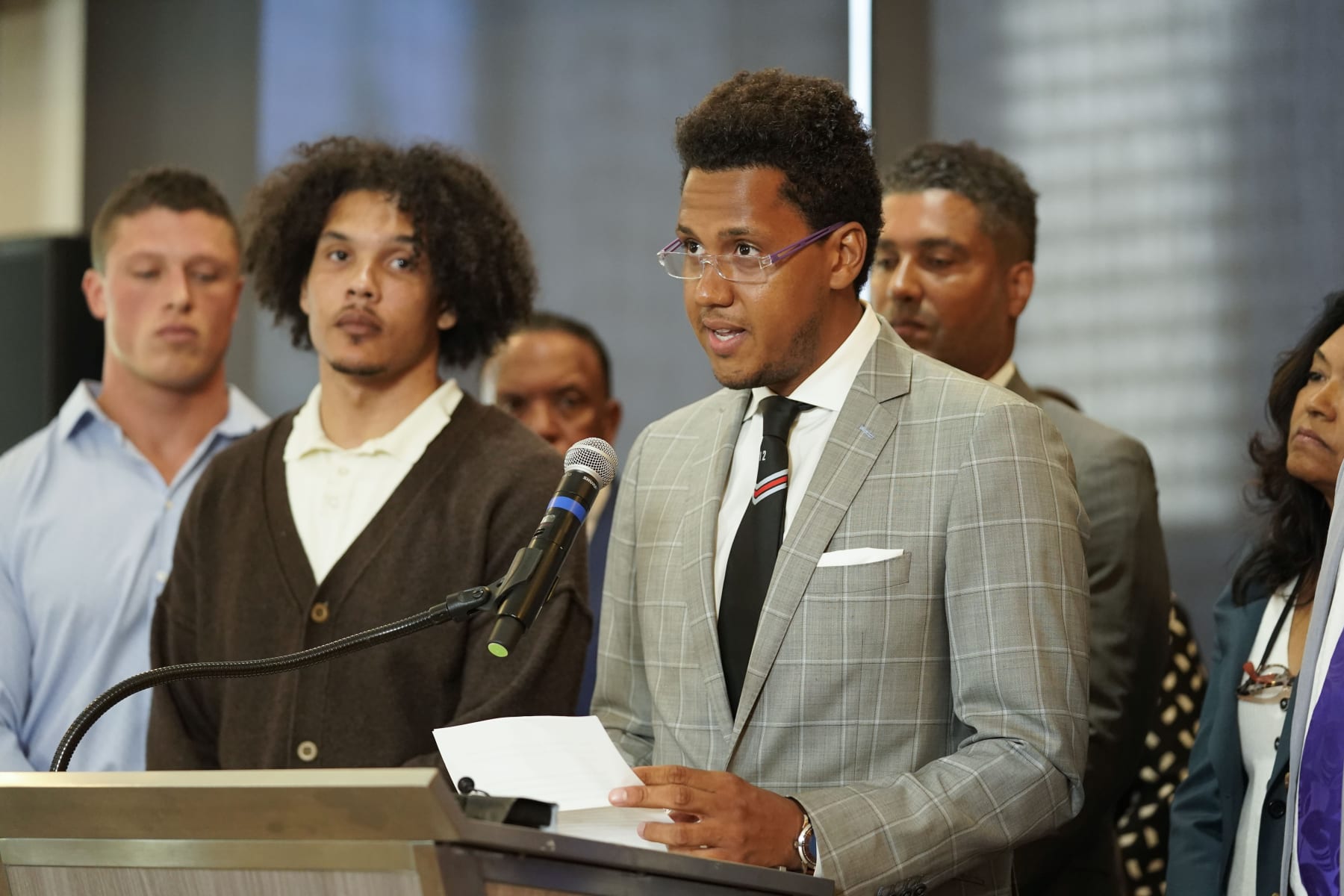 Standing with other former Northwestern athletes, former Northwestern football player Lloyd Yates speaks during a press conference addressing widespread hazing accusations at Northwestern University Wednesday, July 19, 2023, in Chicago. (AP Photo/Erin Hooley)
