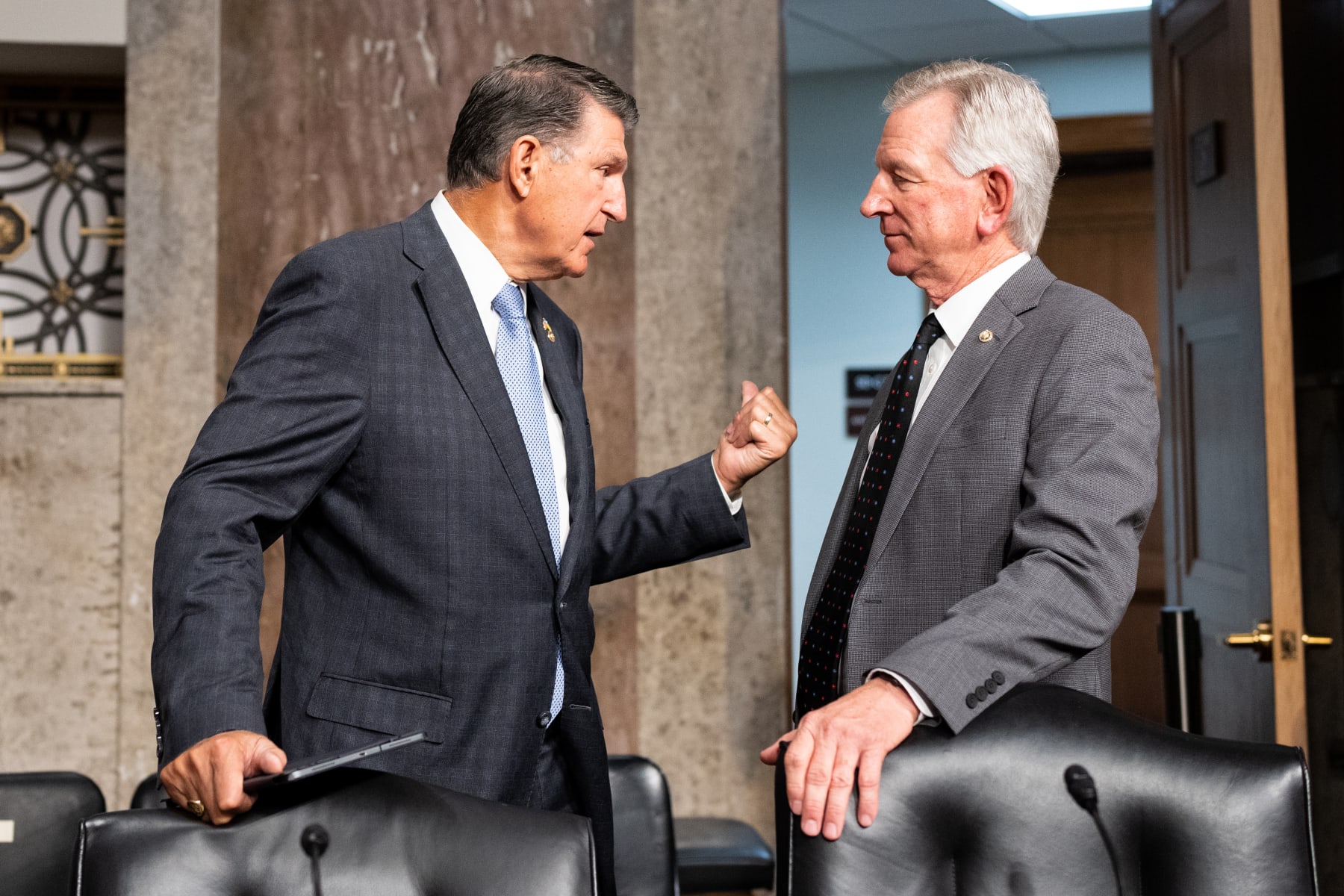 WASHINGTON - JULY 11: Sen. Joe Manchin, D-W. Va., left, and Sen. Tommy Tuberville, R-Ala., talk before the start of the confirmation hearing for Chairman of the Joint Chiefs of Staff nominee General Charles Brown Jr., in the Senate Armed Services Committee on Tuesday, July 11, 2023. (Bill Clark/CQ-Roll Call, Inc via Getty Images) WASHINGTON - JULY 11: Sen. Joe Manchin, D-W. Va., left, and Sen. Tommy Tuberville, R-Ala., talk before the start of the confirmation hearing for Chairman of the Joint Chiefs of Staff nominee General Charles Brown Jr., in the Senate Armed Services Committee on Tuesday, July 11, 2023. (Bill Clark/CQ-Roll Call, Inc via Getty Images)