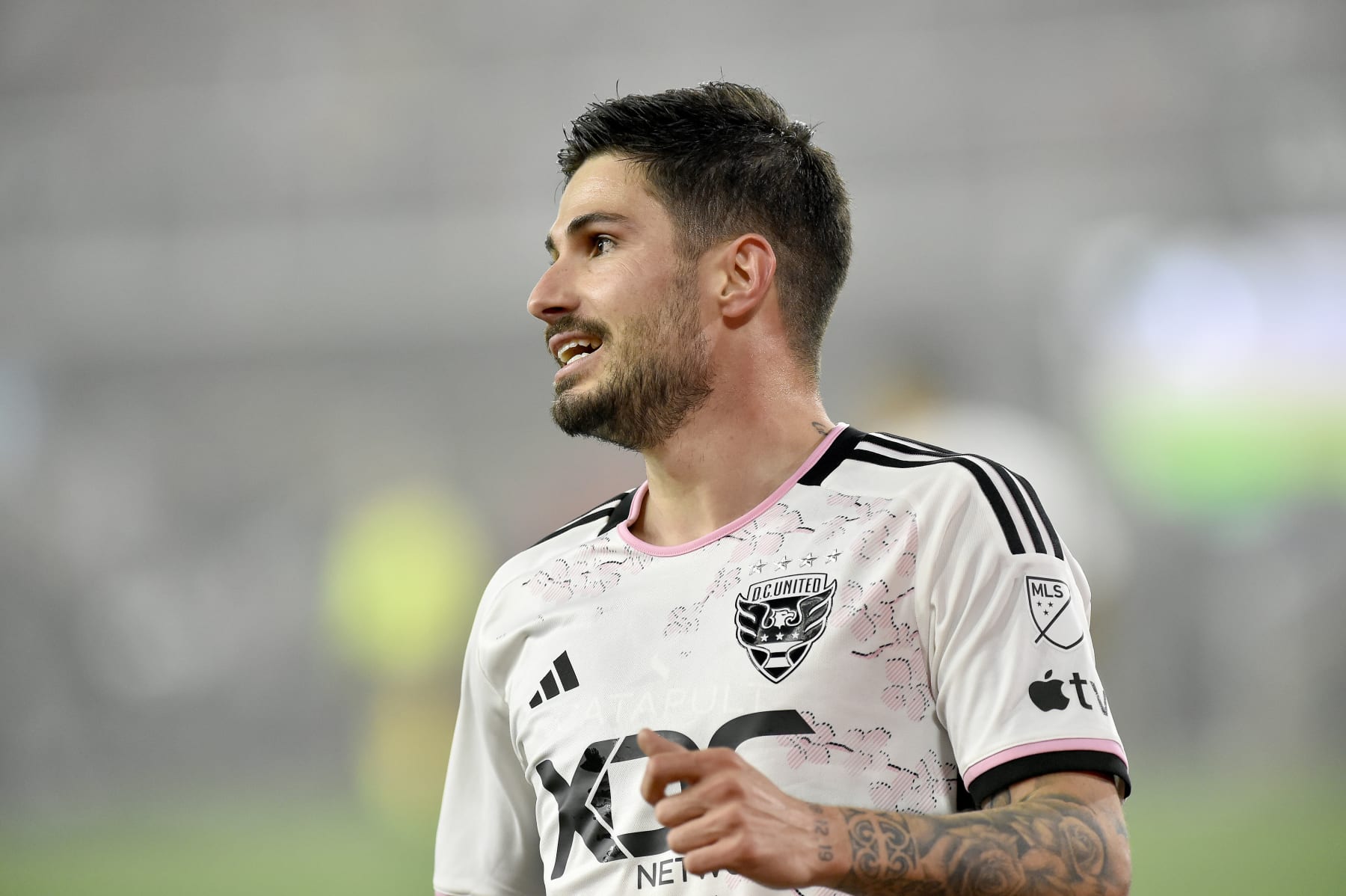 WASHINGTON, DC - MARCH 25: DC United midfielder Taxiarchis Taxi Fountas (11) reacts while wearing the D.C. United Cherry Blossom Kit Jersey during the New England Revolution versus D.C. United Major League Soccer (MLS) game on March 25, 2023 at Audi Field in Washington, D.C.. (Photo by Randy Litzinger/Icon Sportswire via Getty Images)
