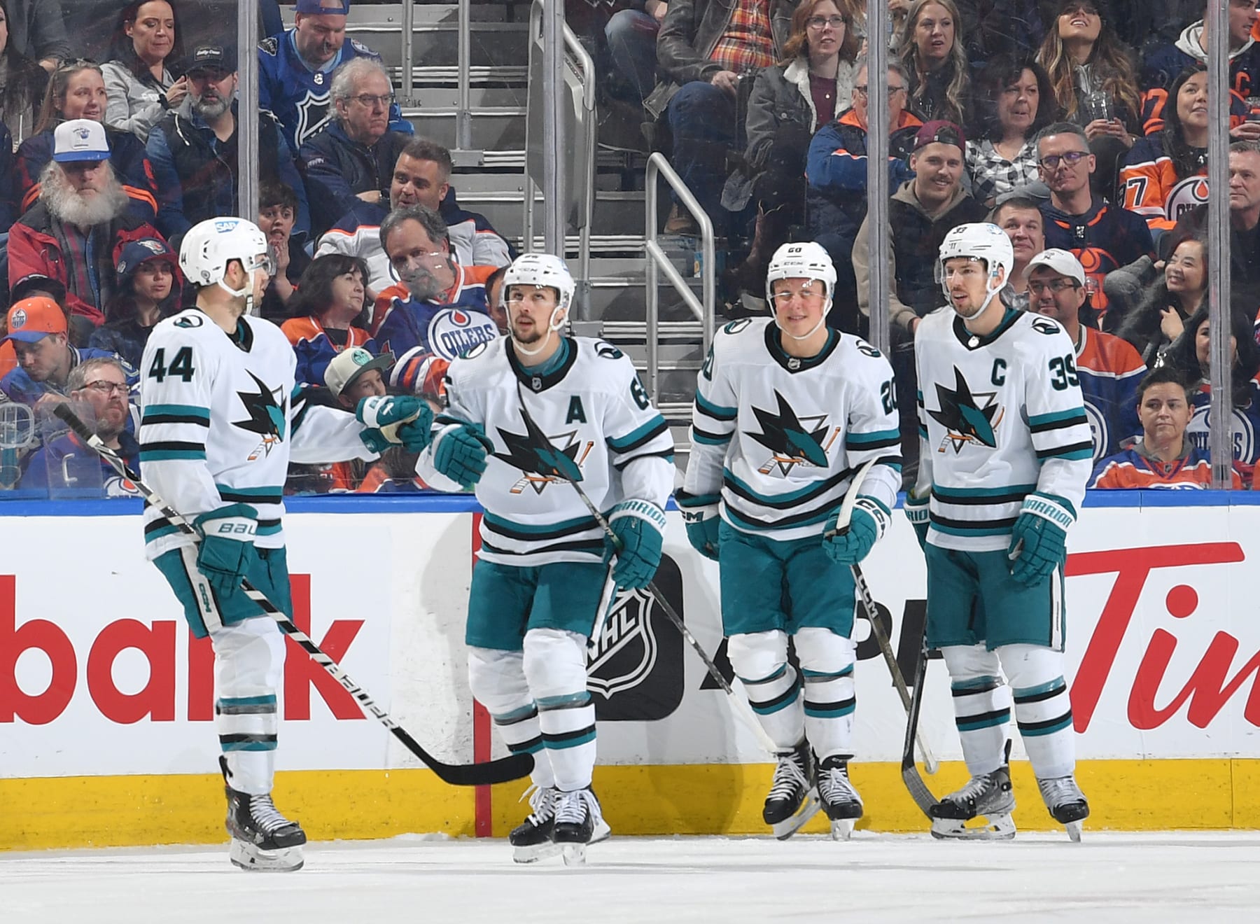 EDMONTON, CANADA - MARCH 20: Erik Karlsson #65 of the San Jose Sharks celebrates his first goal of the game in the second period against the Edmonton Oilers with Marc-Edouard Vlasic #44, Fabian Zetterlund #20 and Logan Couture #39 on March 20, 2023 at Rogers Place in Edmonton, Alberta, Canada. (Photo by Andy Devlin/NHLI via Getty Images)